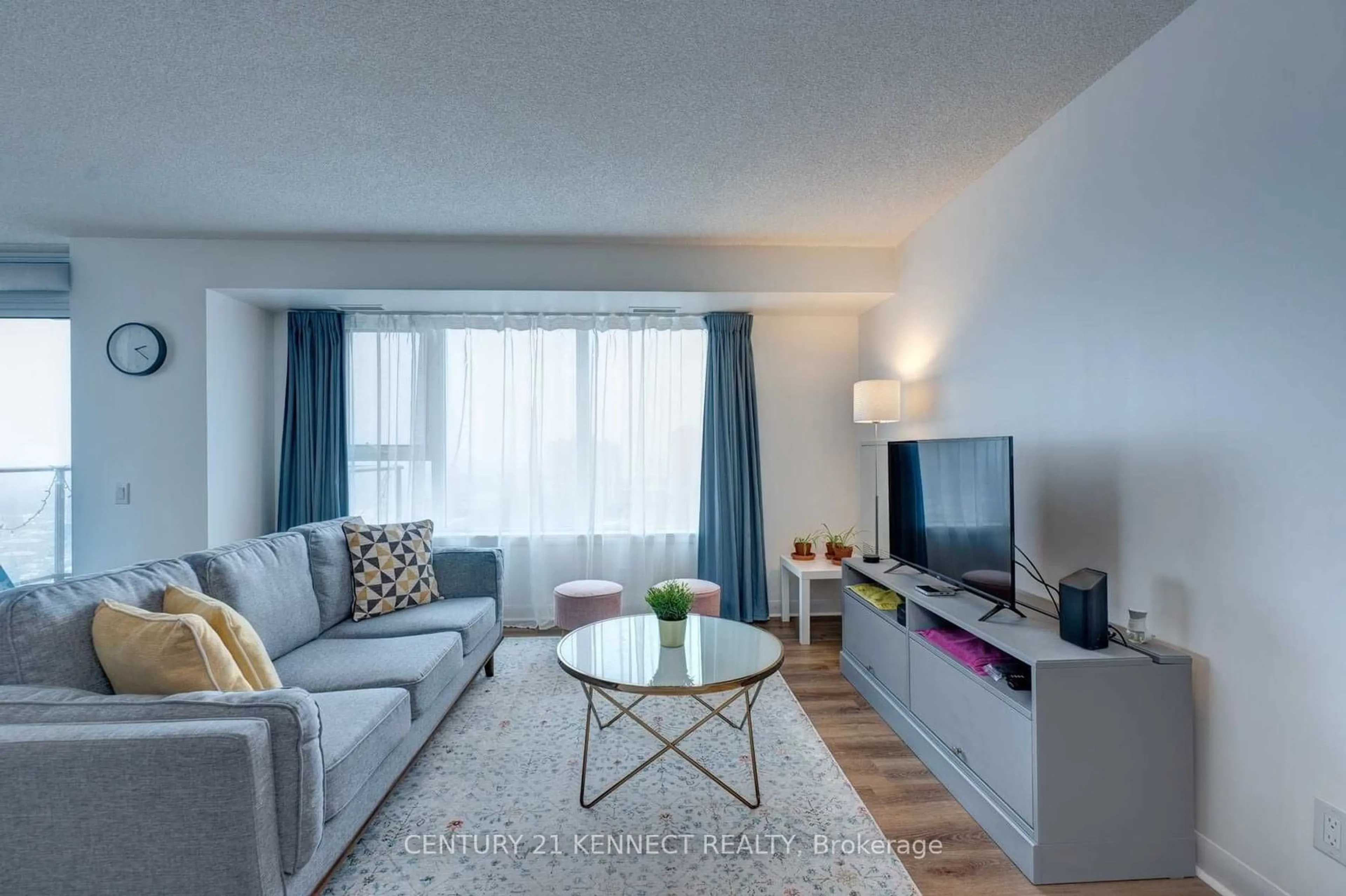 Living room with furniture, wood/laminate floor for 190 Borough Dr #2508, Toronto Ontario M1P 0B6