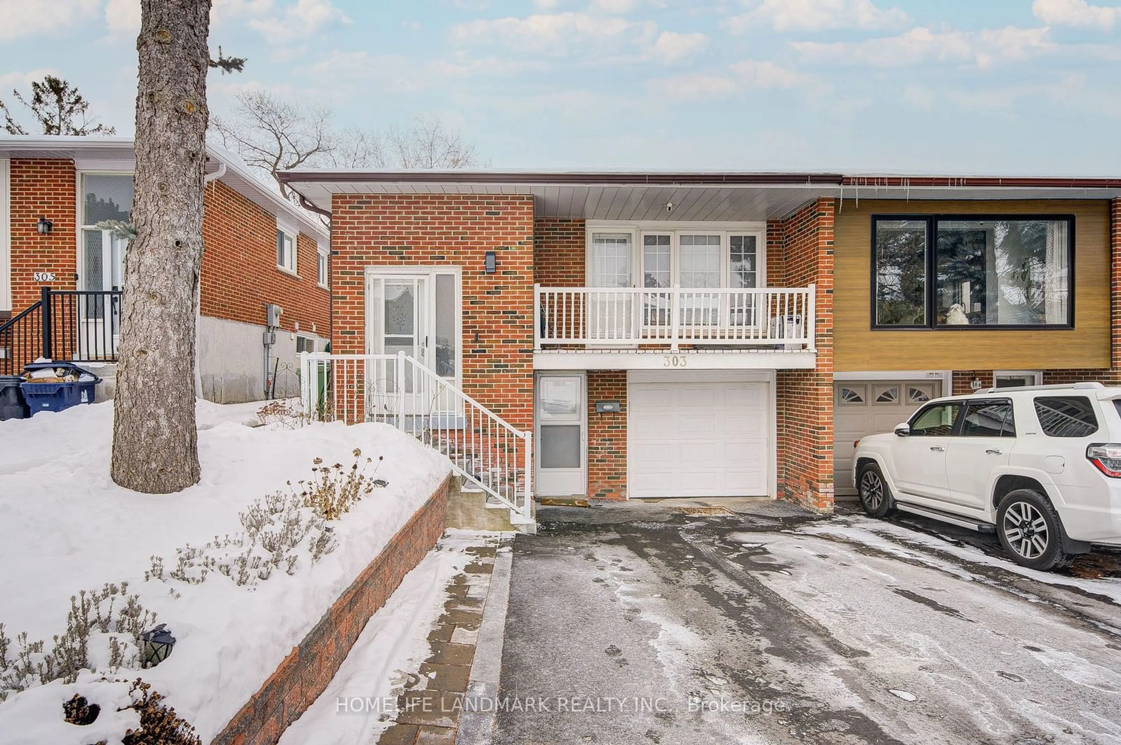 Home with brick exterior material, street for 303 Timberbank Blvd, Toronto Ontario M1W 2G9