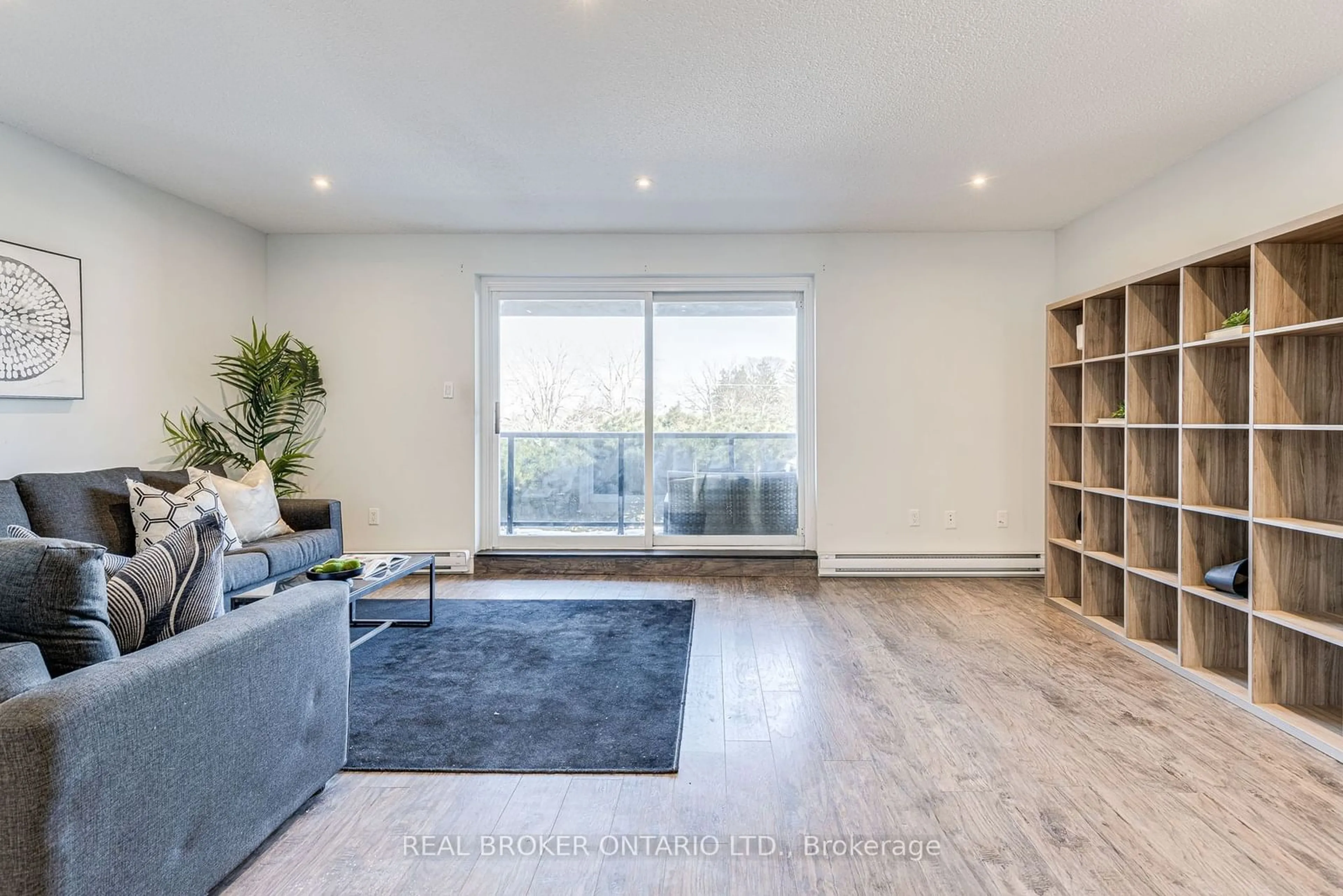 Living room with furniture, wood/laminate floor for 50 Scarborough Golf Club Rd #114, Toronto Ontario M1M 3T5