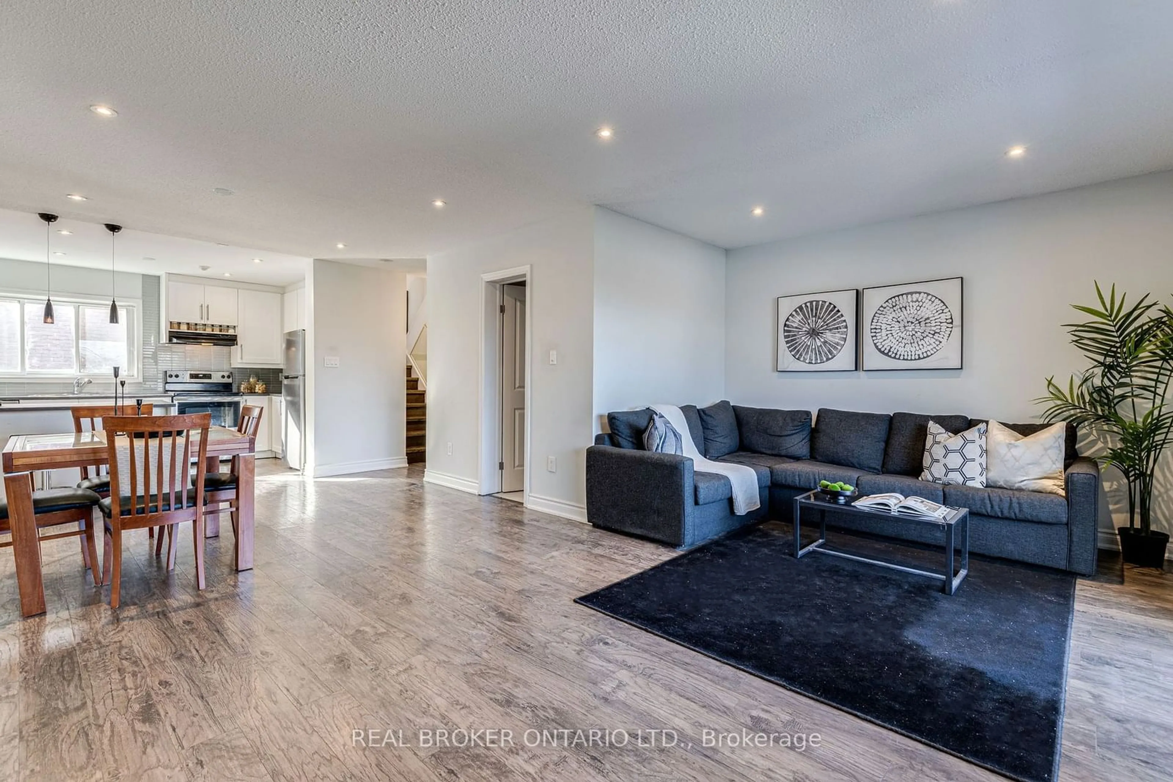 Living room with furniture, wood/laminate floor for 50 Scarborough Golf Club Rd #114, Toronto Ontario M1M 3T5