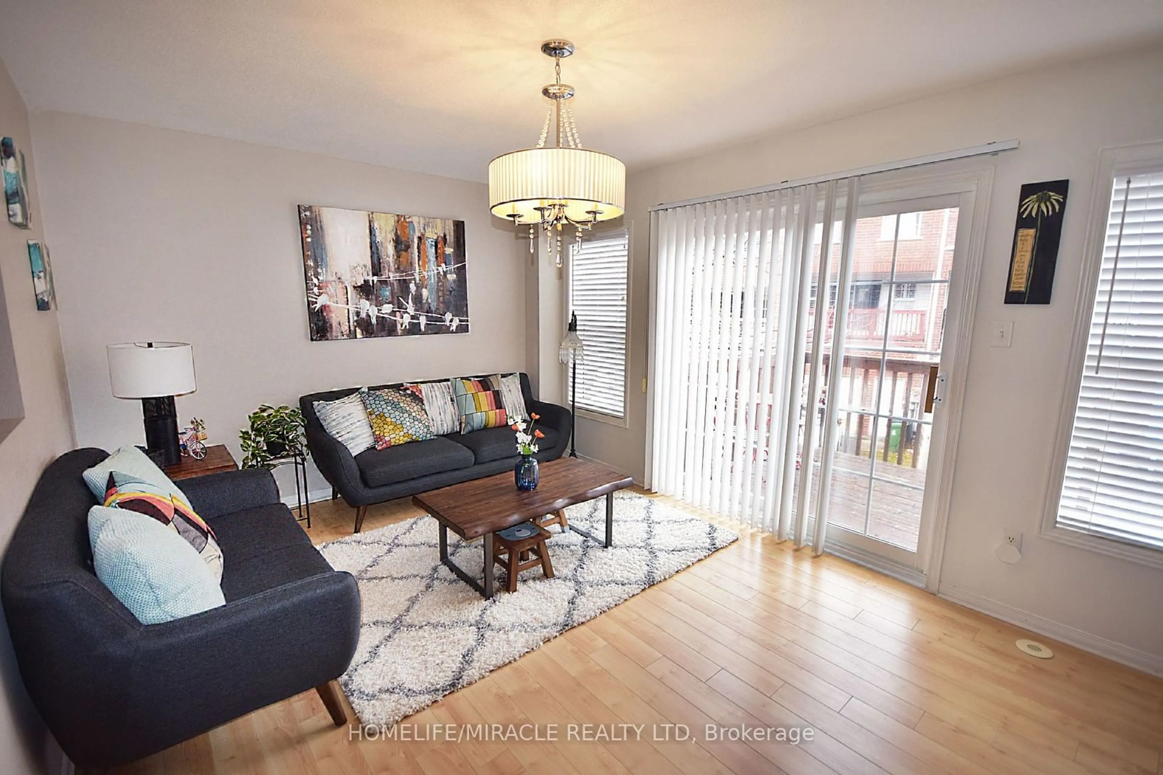 Living room with furniture, wood/laminate floor for 22 Exchequer Pl, Toronto Ontario M1S 5R9