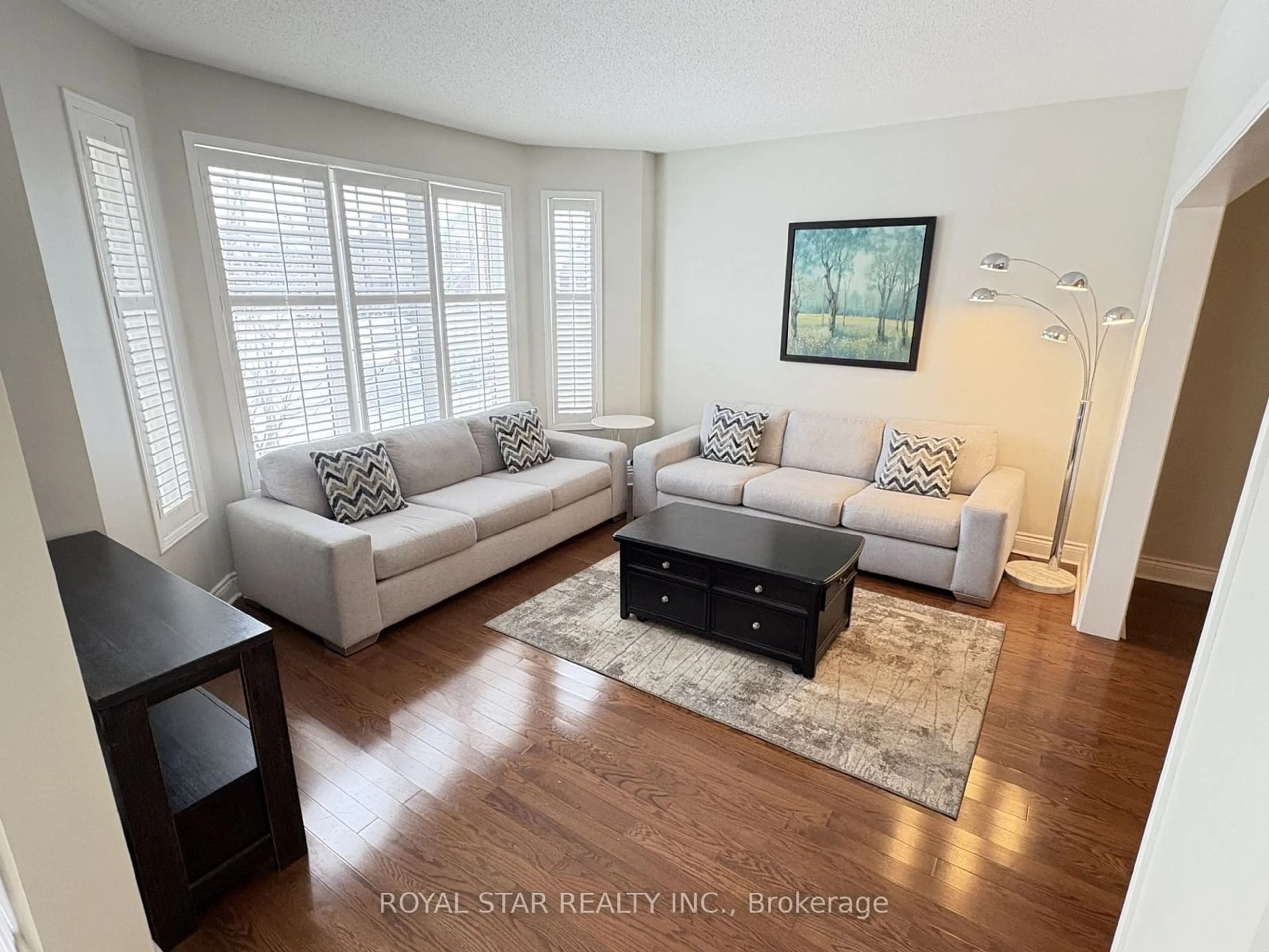 Living room with furniture, wood/laminate floor for 50 Oshea Cres, Ajax Ontario L1T 4W8