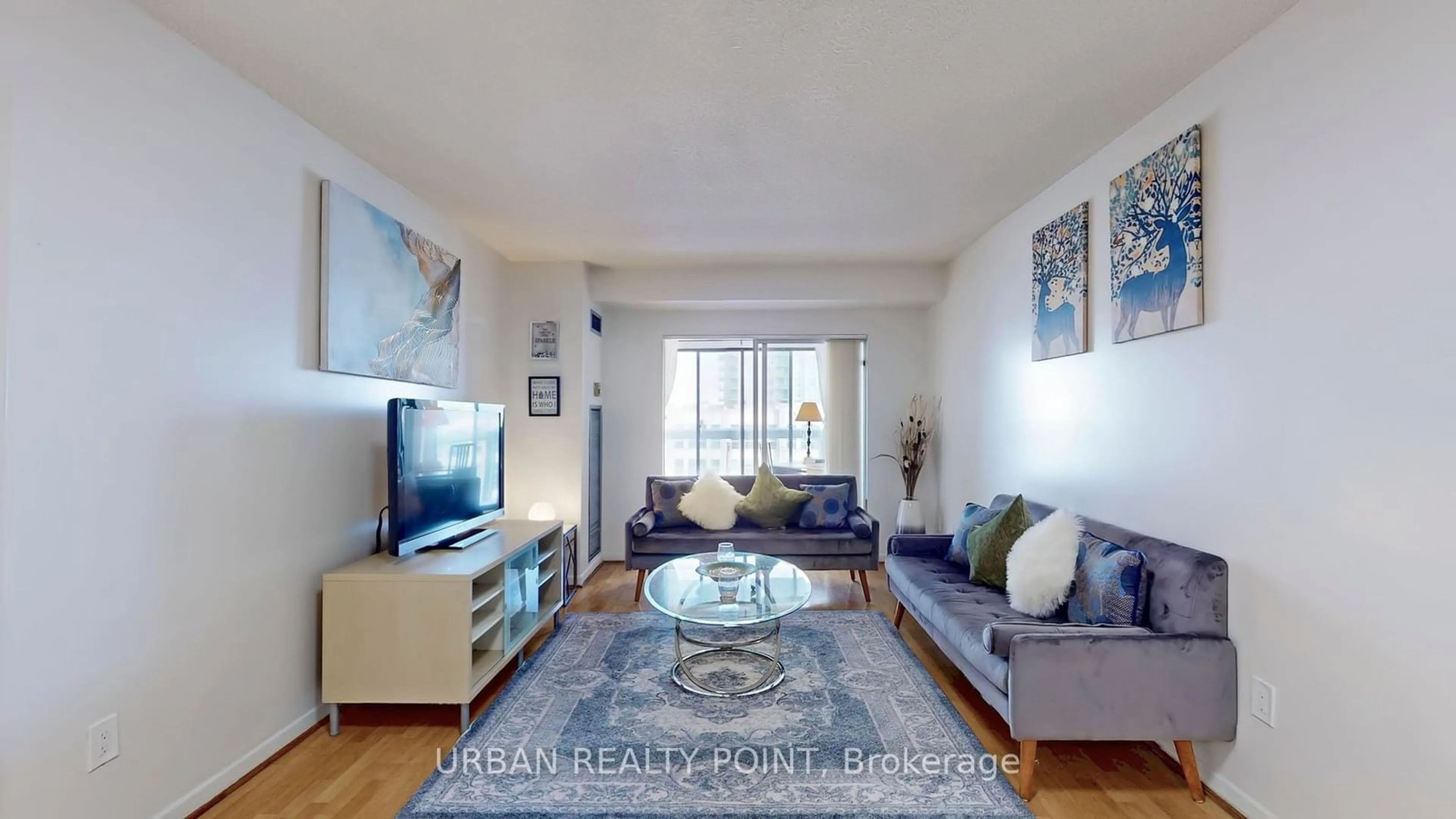 Living room with furniture, wood/laminate floor for 39 Kimbercroft Crt #615, Toronto Ontario M1S 5B5