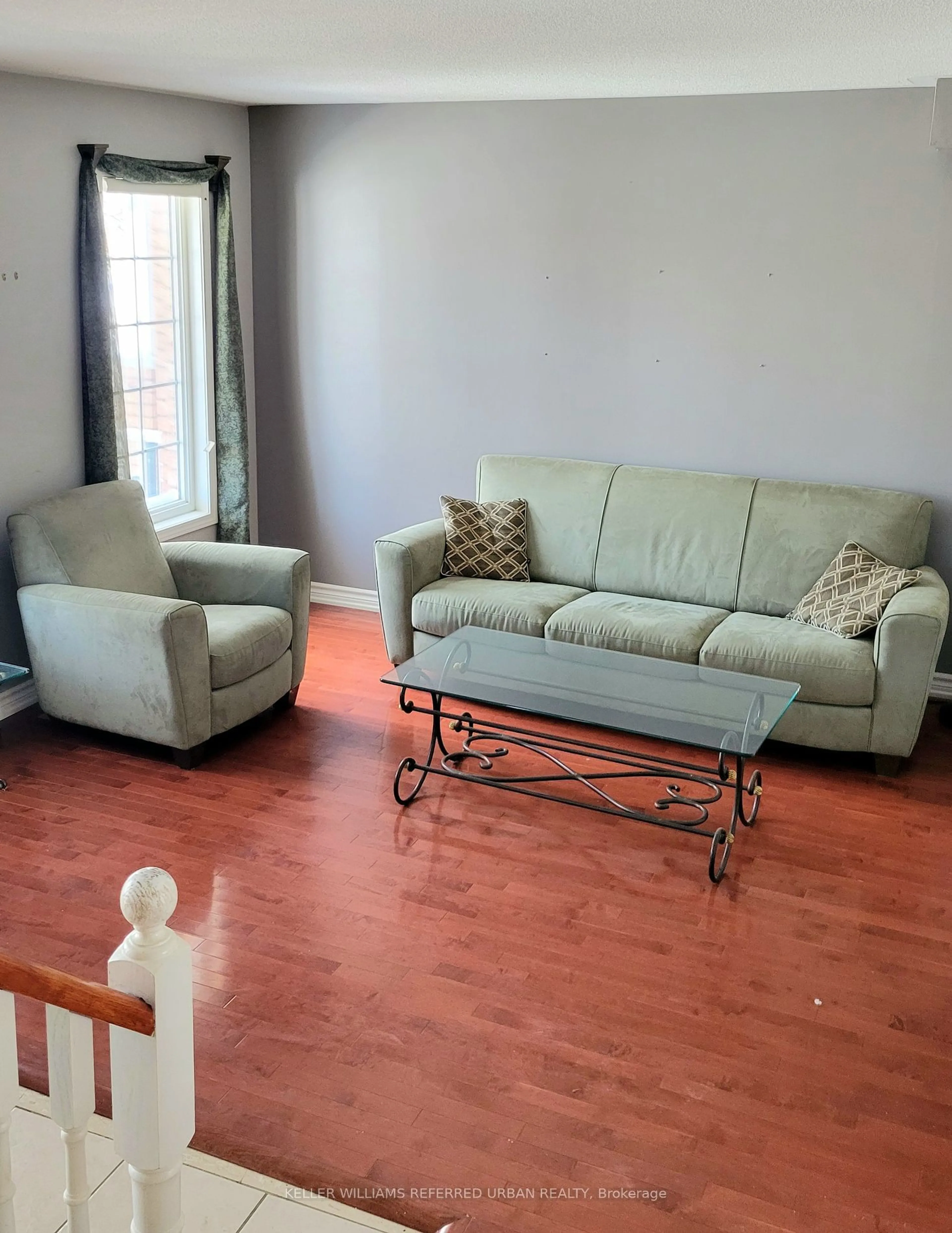 Living room with furniture, wood/laminate floor for 14 Bayside Gate, Whitby Ontario L1N 9T1