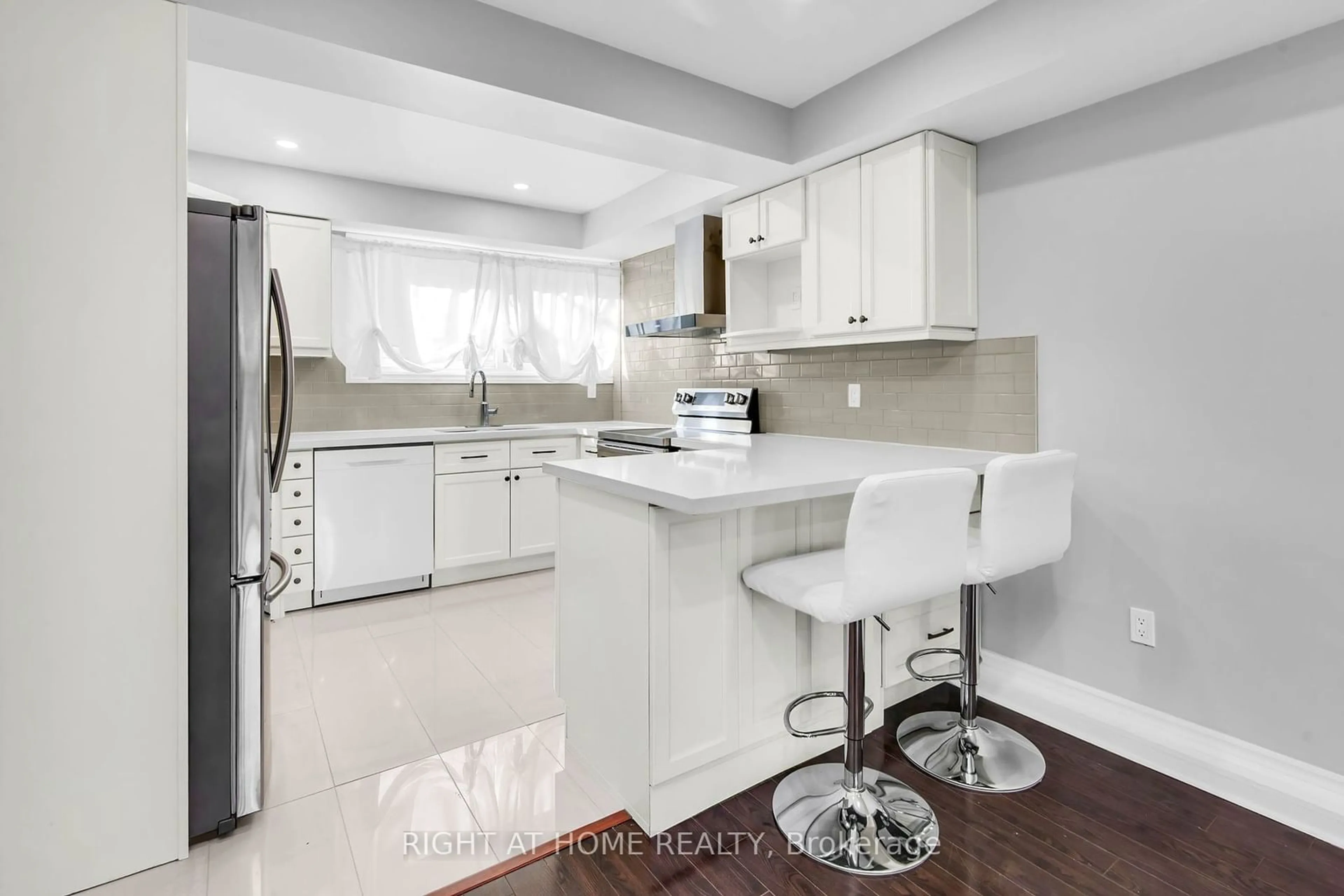 Open concept kitchen, ceramic/tile floor for 2716 St Clair Ave #13, Toronto Ontario M4B 1M6