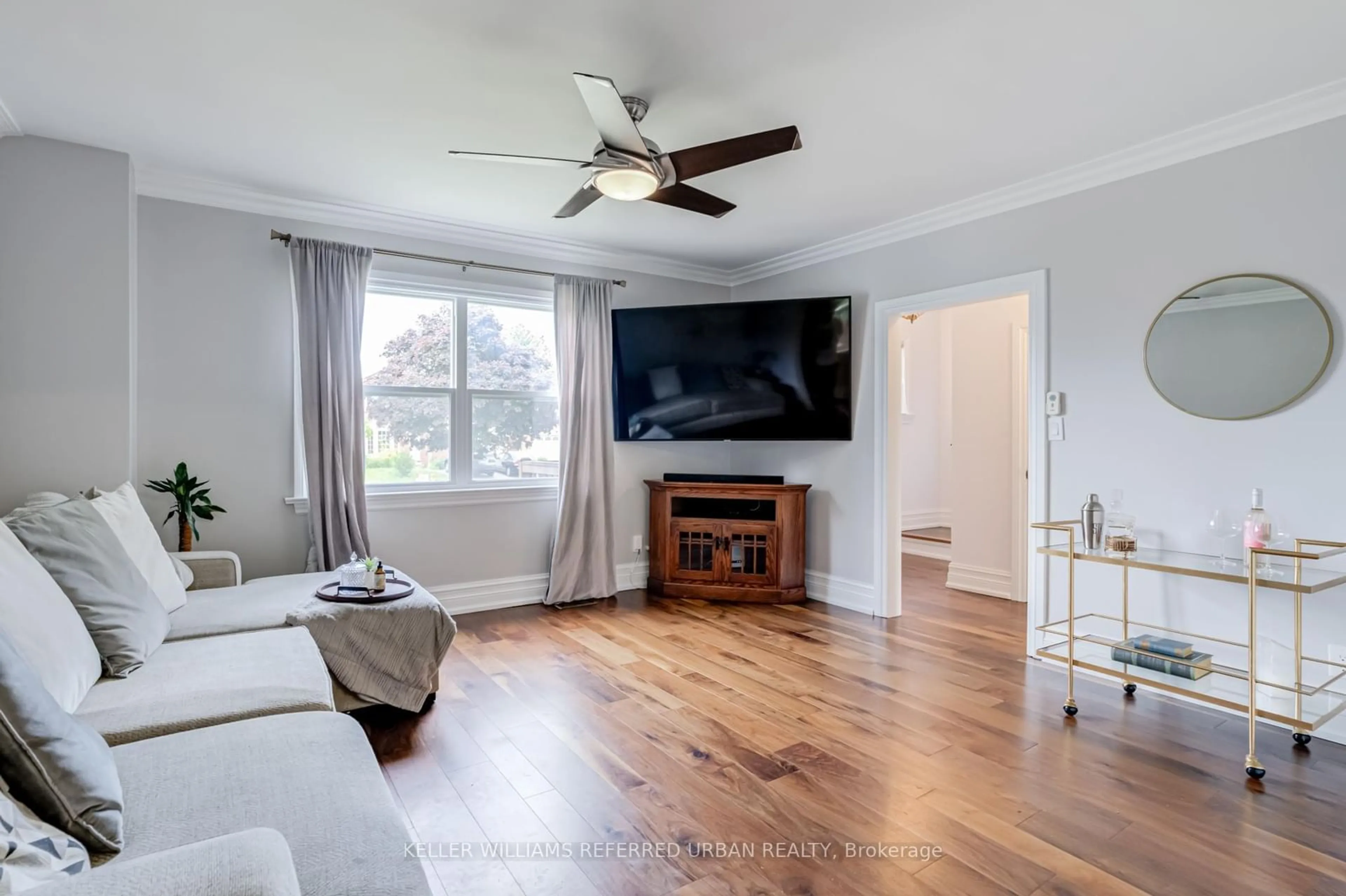 Living room with furniture, wood/laminate floor for 20 Payzac Ave, Toronto Ontario M1E 2W7