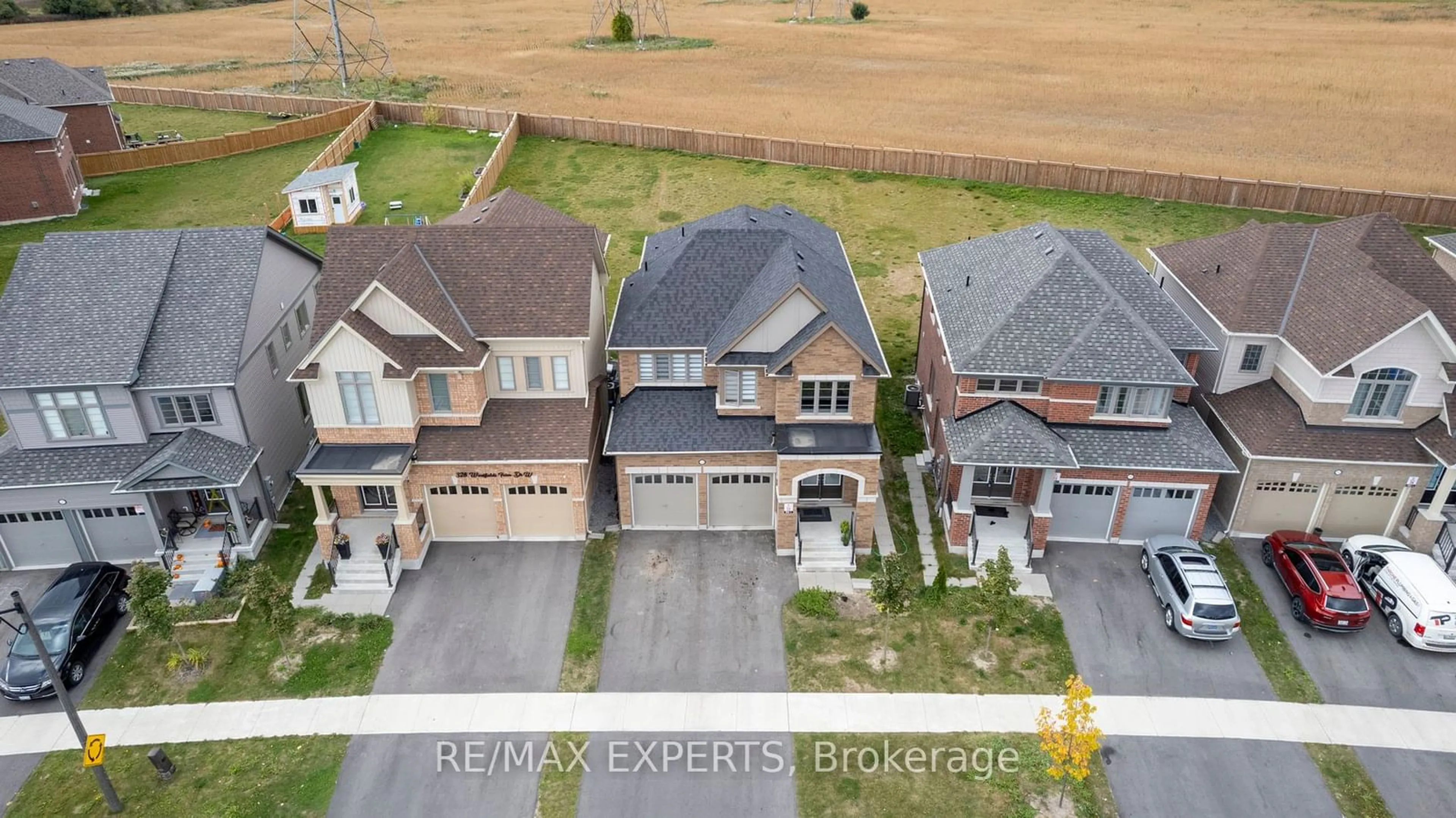 A pic from outside/outdoor area/front of a property/back of a property/a pic from drone, street for 324 Windfields Farm Dr, Oshawa Ontario L1L 0M3