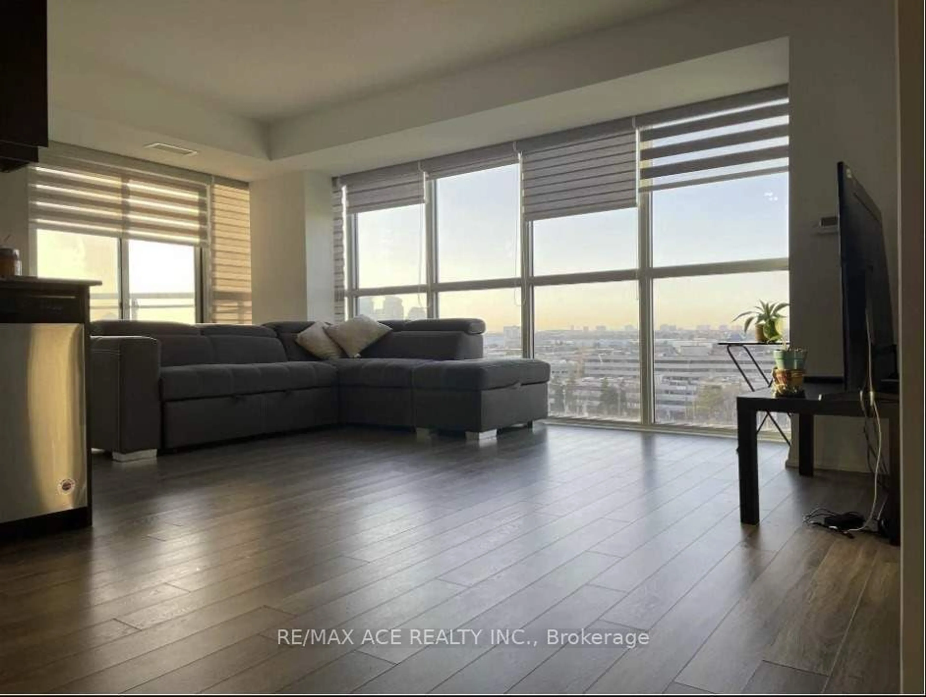 Living room with furniture, wood/laminate floor for 30 Meadowglen Pl #903, Toronto Ontario M1B 1V8