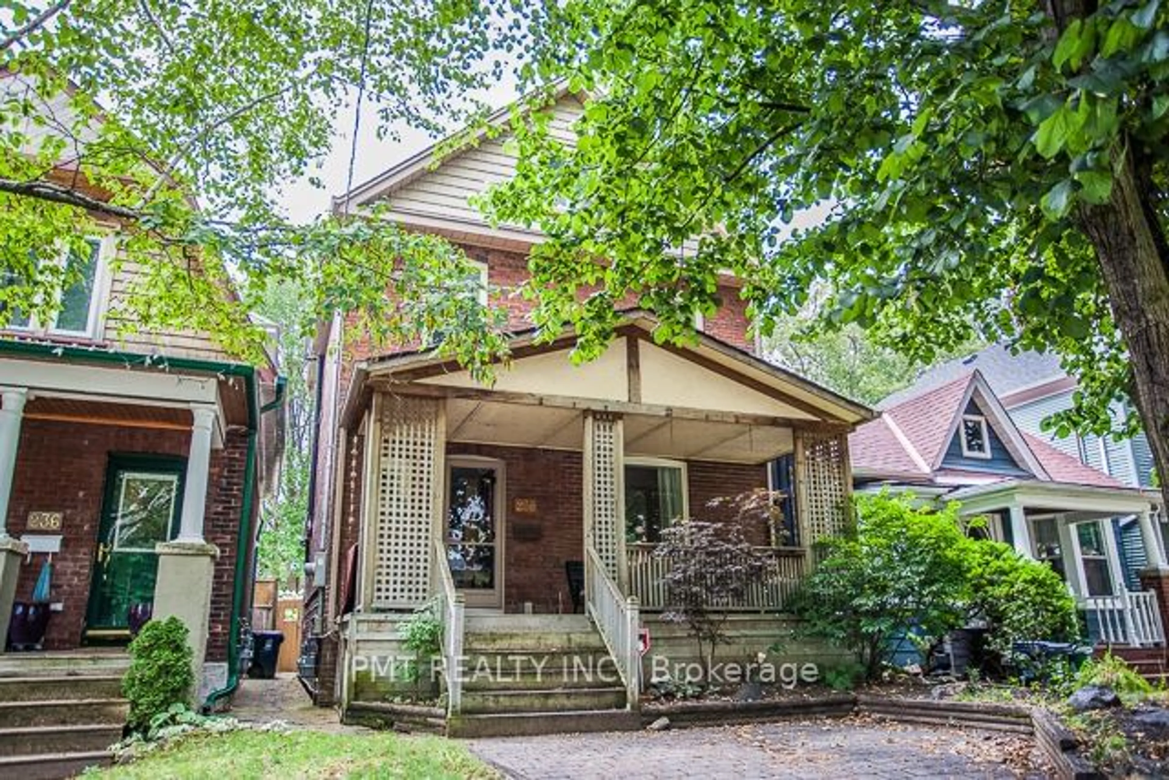 Home with brick exterior material, street for 238 Woodfield Rd, Toronto Ontario M4L 2W7