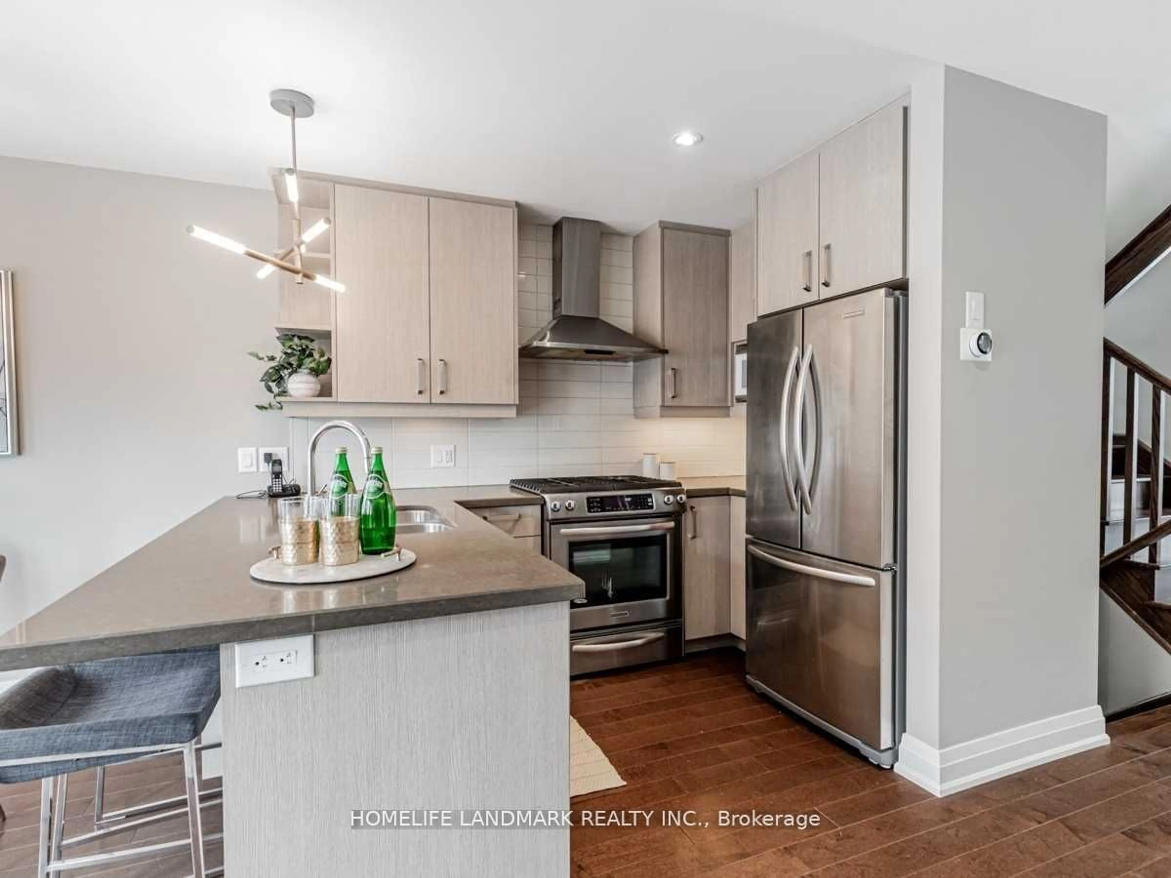 Open concept kitchen, wood/laminate floor for 158b Glebemount Ave, Toronto Ontario M4C 3S7