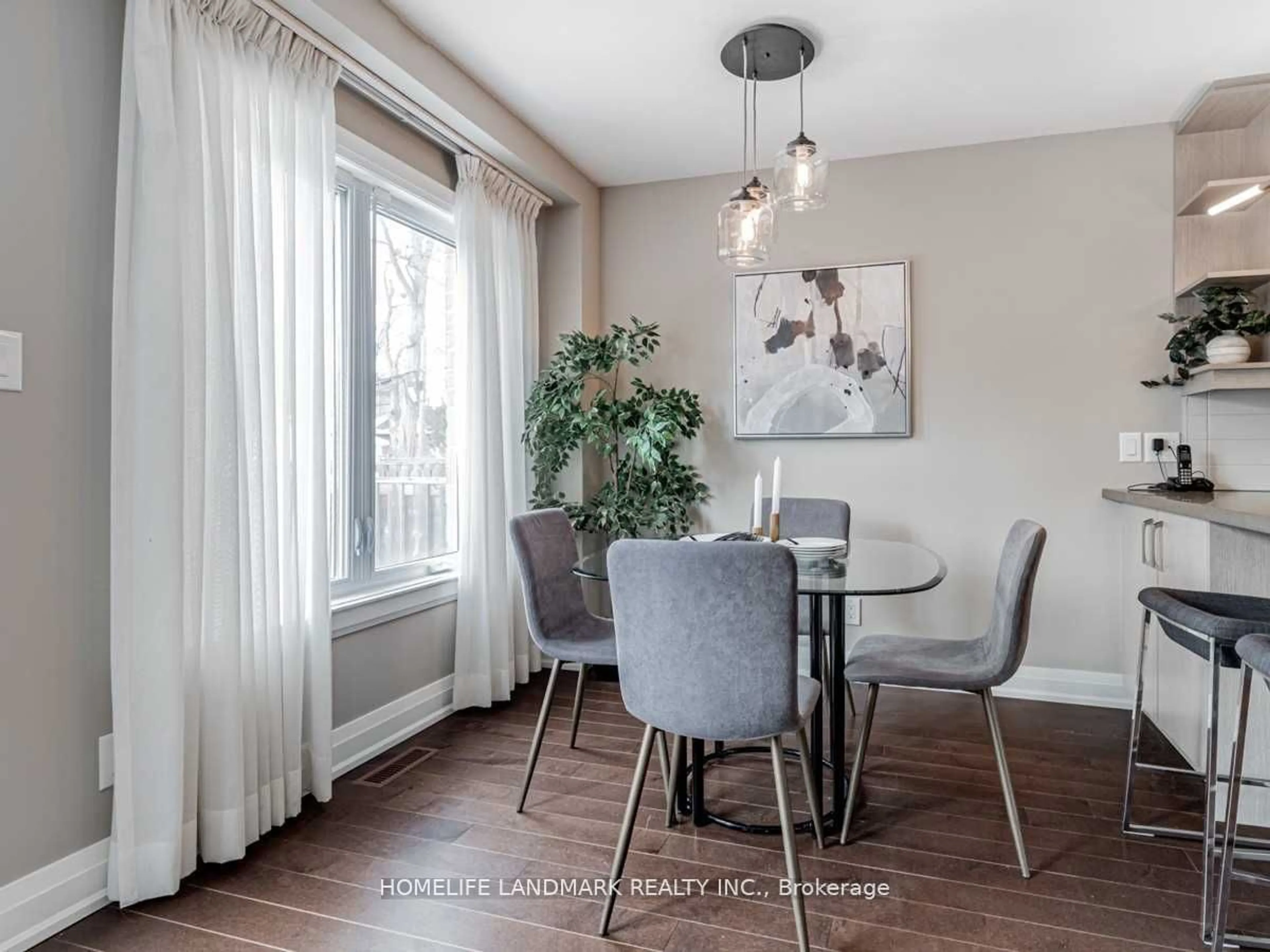 Dining room, wood/laminate floor for 158b Glebemount Ave, Toronto Ontario M4C 3S7