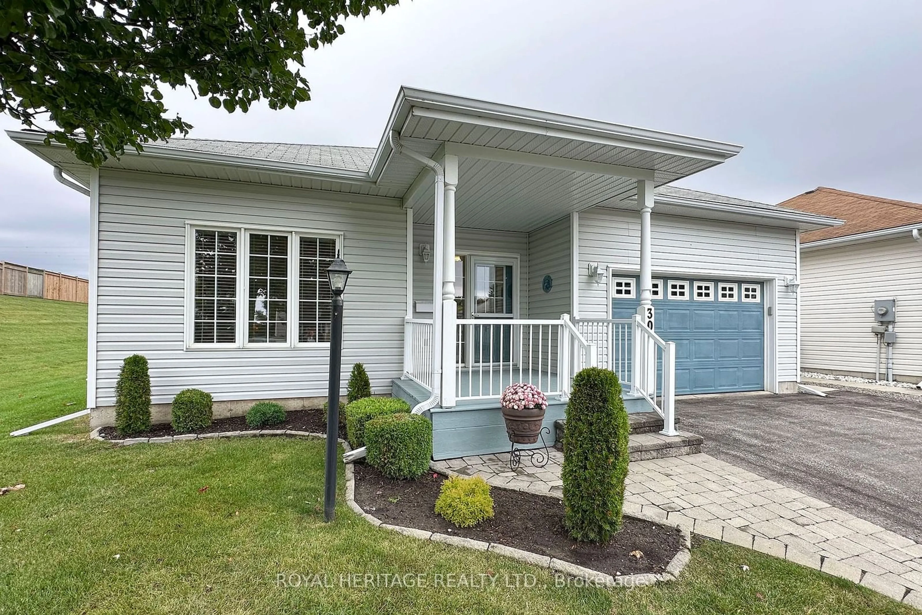 Home with vinyl exterior material, street for 30 Kissingbridge Lane, Clarington Ontario L1B 0B2