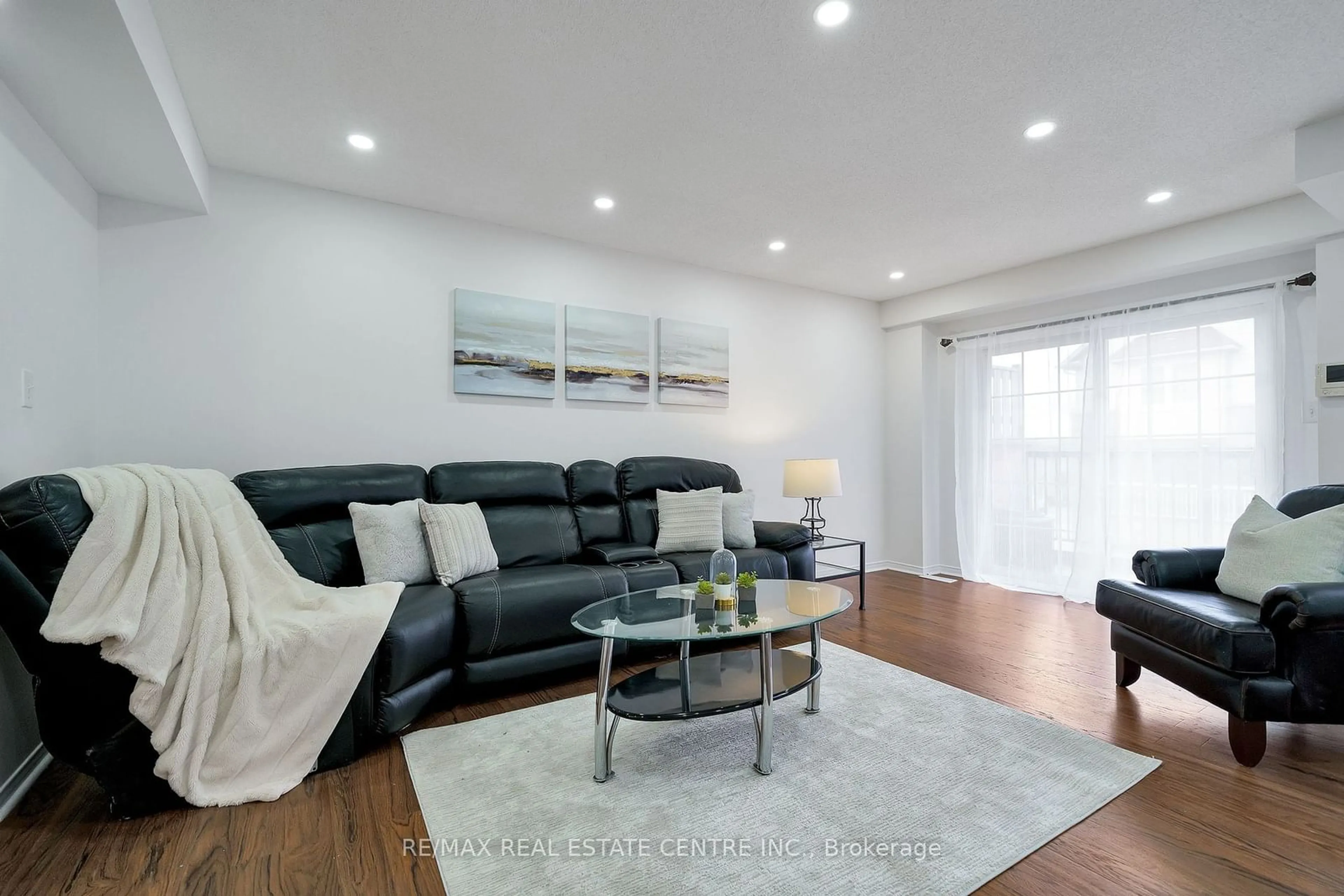 Living room with furniture, wood/laminate floor for 934 Audley Rd, Ajax Ontario L1Z 0K6