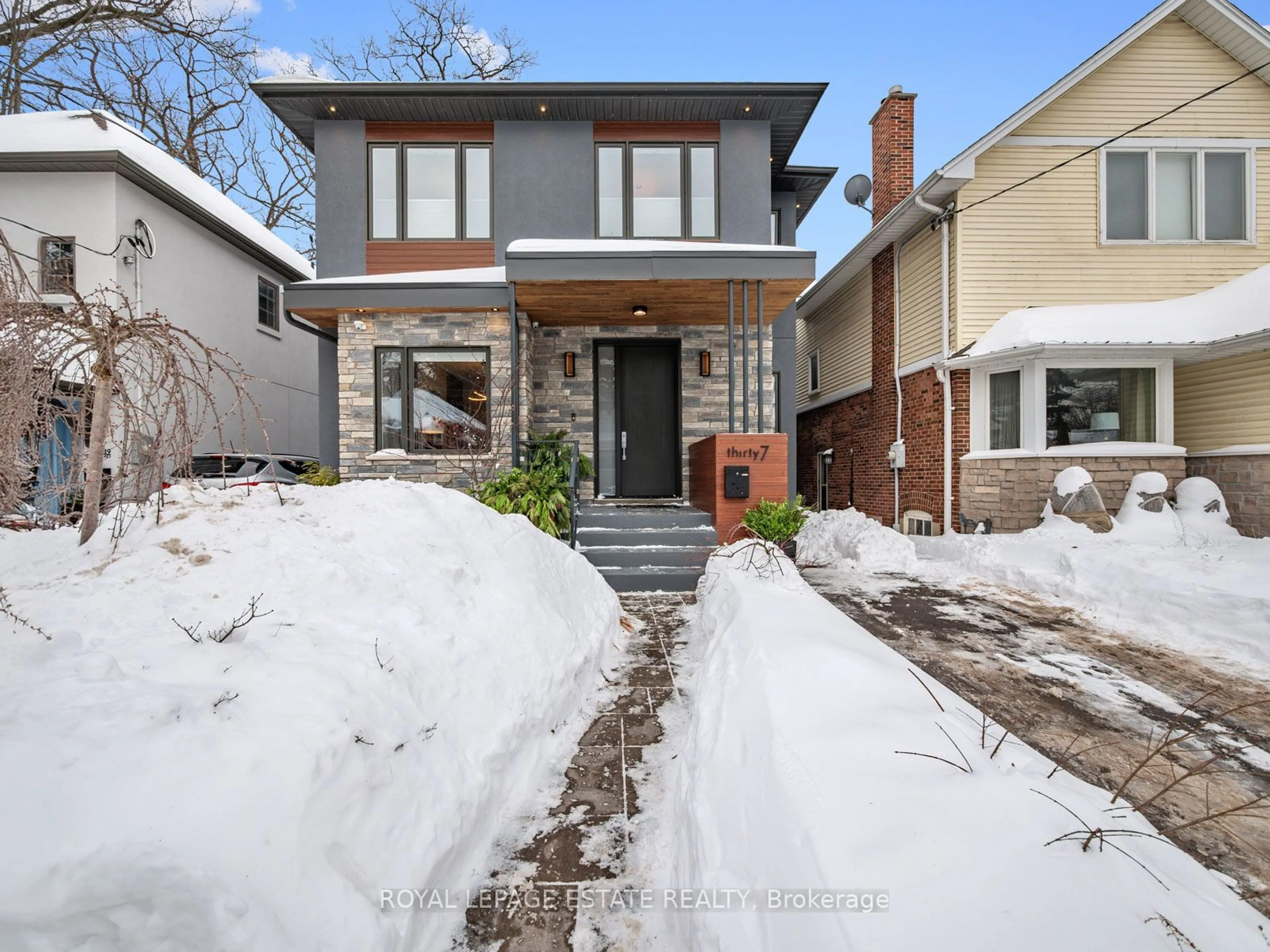 Home with brick exterior material, street for 37 Glen Ames, Toronto Ontario M4E 1M3