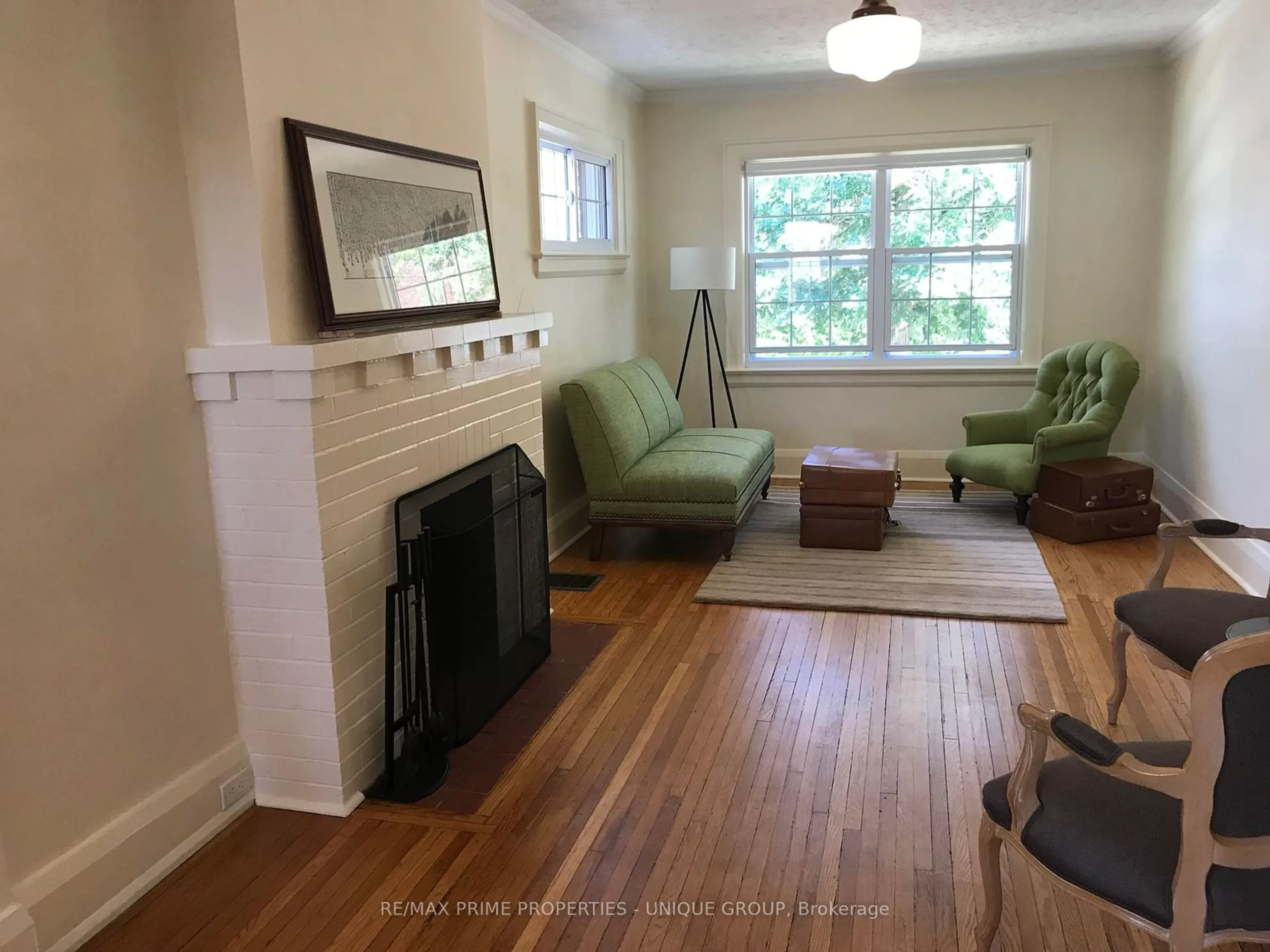 Living room with furniture, wood/laminate floor for 32 Woodington Ave, Toronto Ontario M4C 3J3