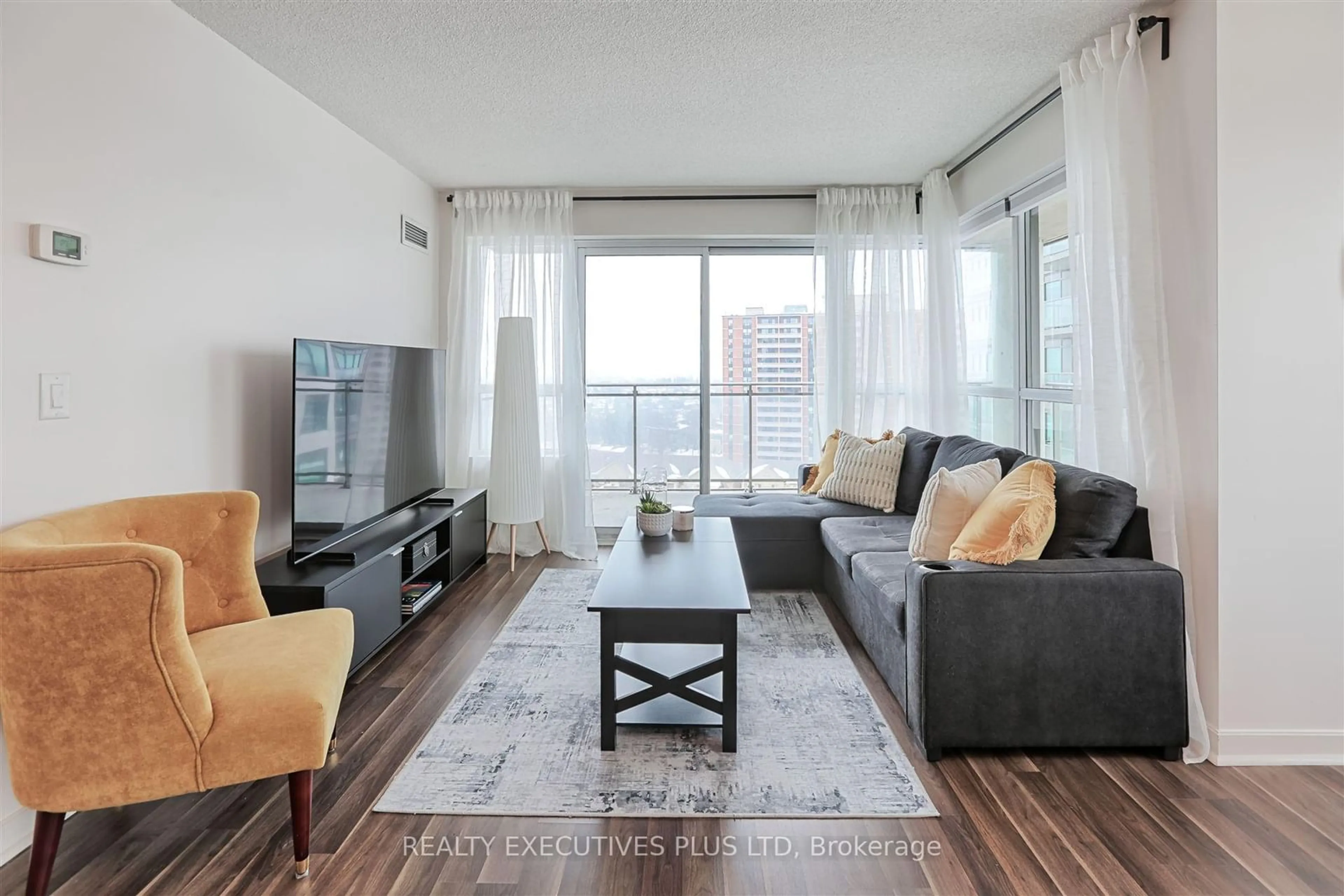 Living room with furniture, wood/laminate floor for 1235 Bayly St #1102, Pickering Ontario L1W 1L7