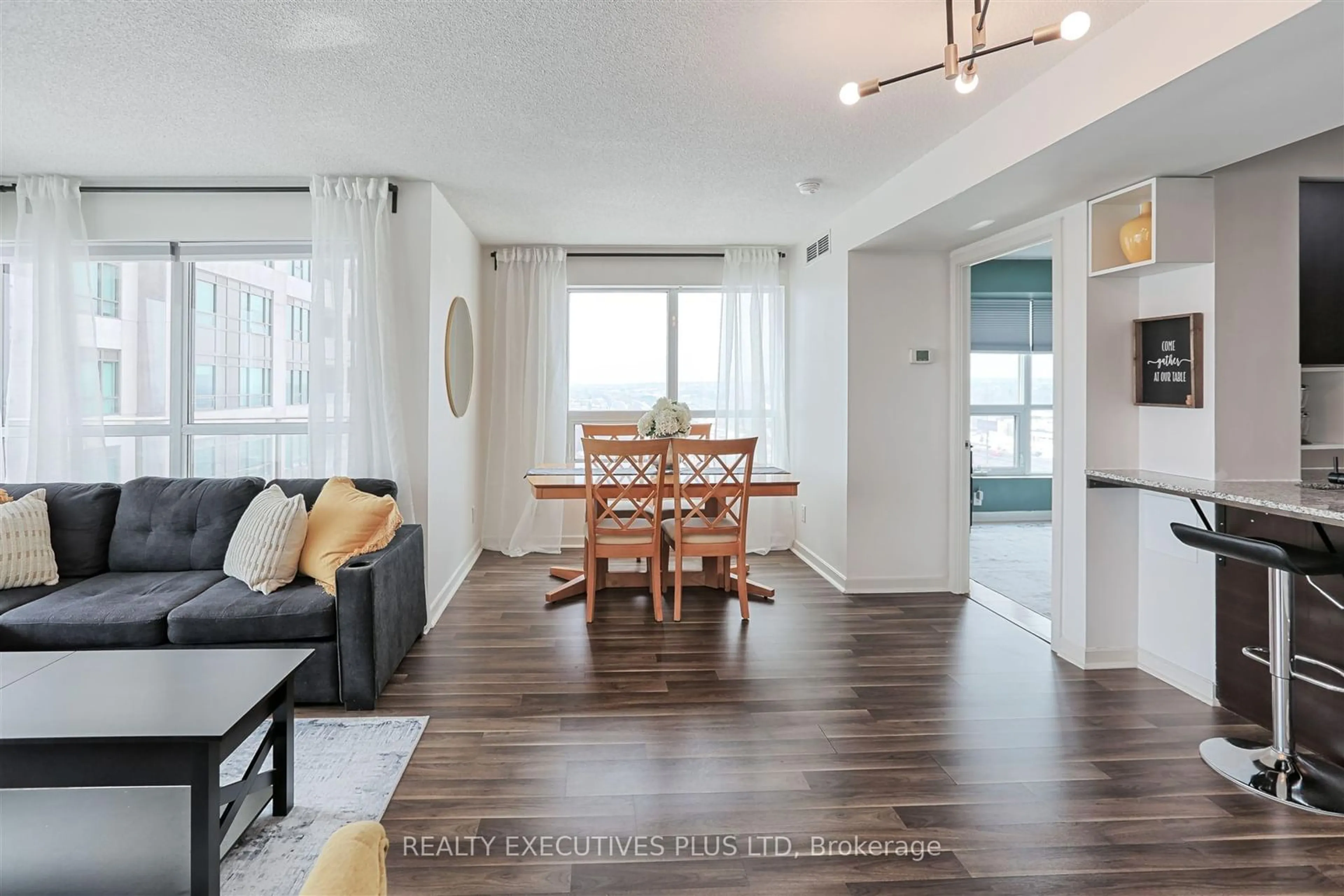 Living room with furniture, wood/laminate floor for 1235 Bayly St #1102, Pickering Ontario L1W 1L7