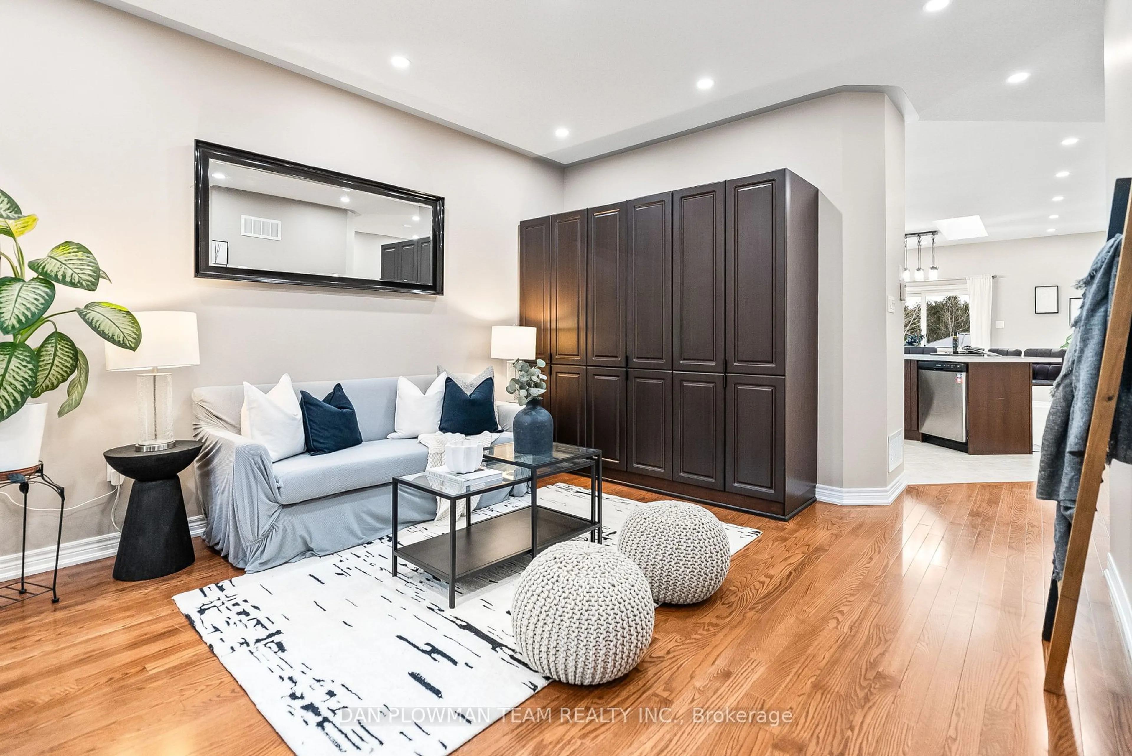 Living room with furniture, wood/laminate floor for 3065 Trulls Rd, Clarington Ontario L1E 2L1