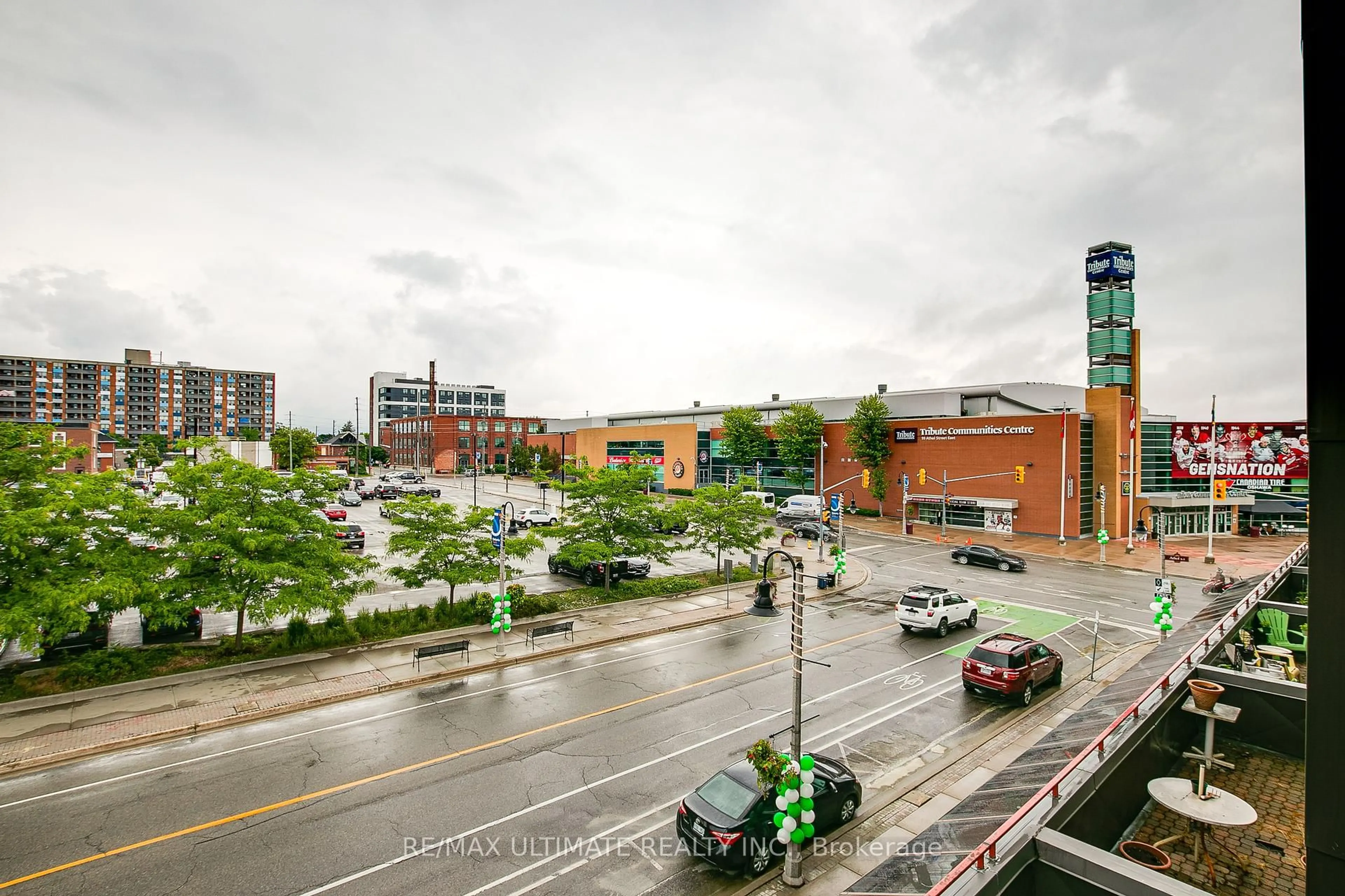 Patio, city buildings view from balcony for 80 Athol St #309, Oshawa Ontario L1H 8B7