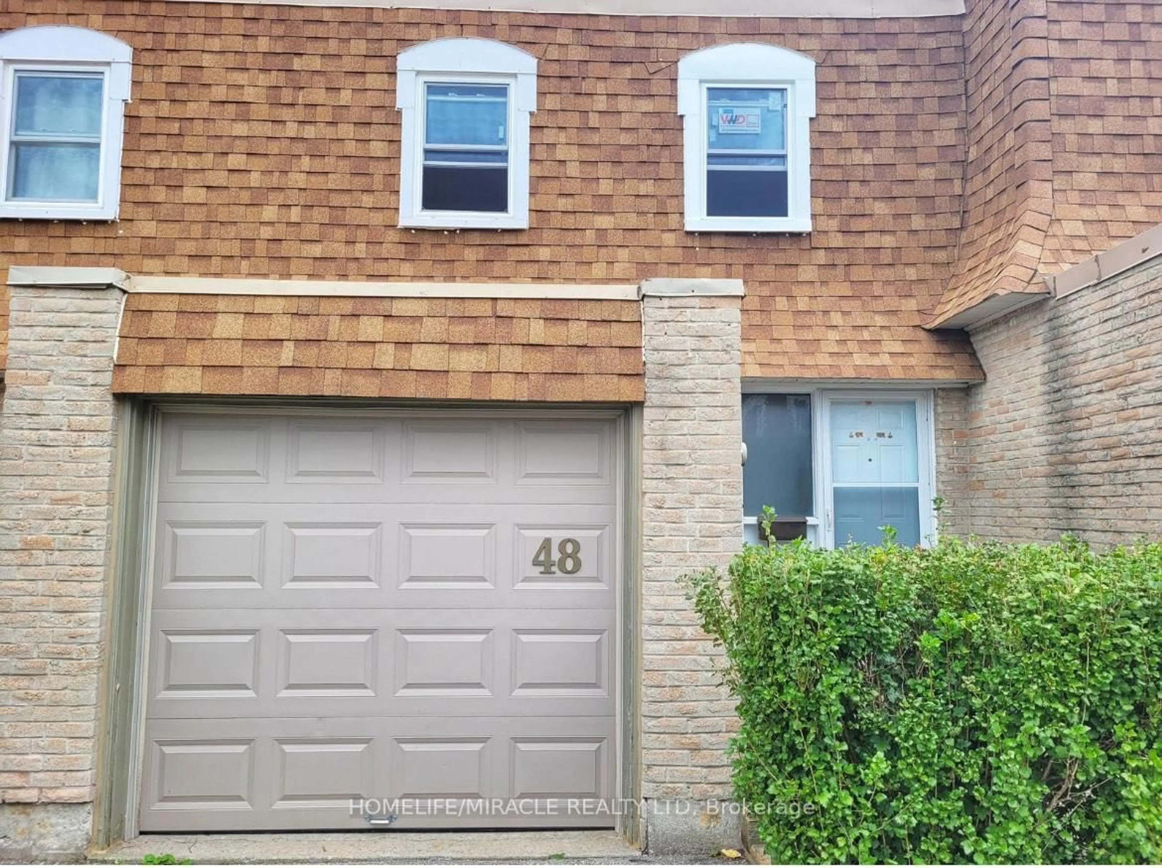 Home with brick exterior material, street for 850 Hunting Wood #48, Toronto Ontario M1T 2L9