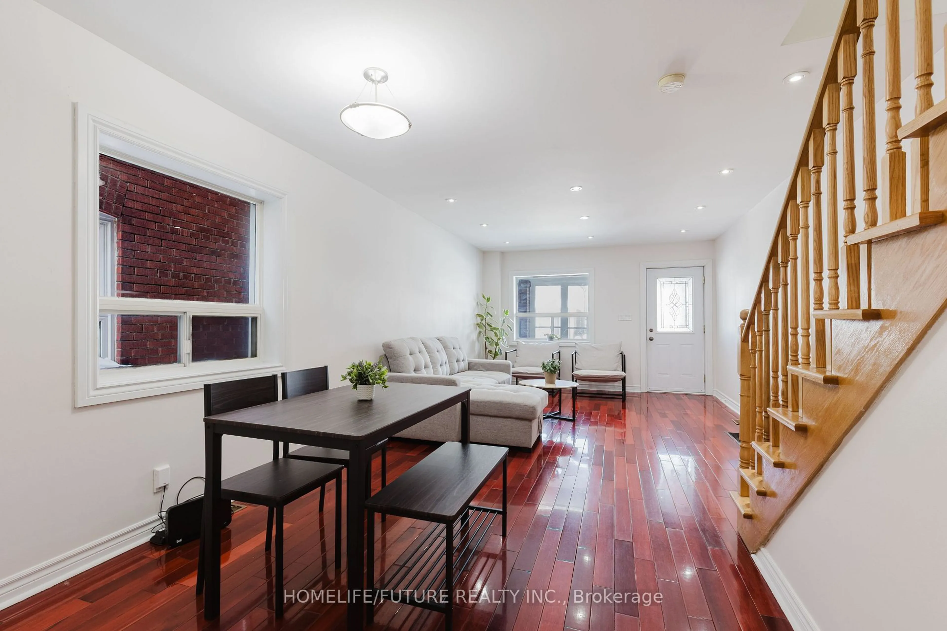 Dining room, wood/laminate floor for 58 Sibley Ave, Toronto Ontario M4C 5E9