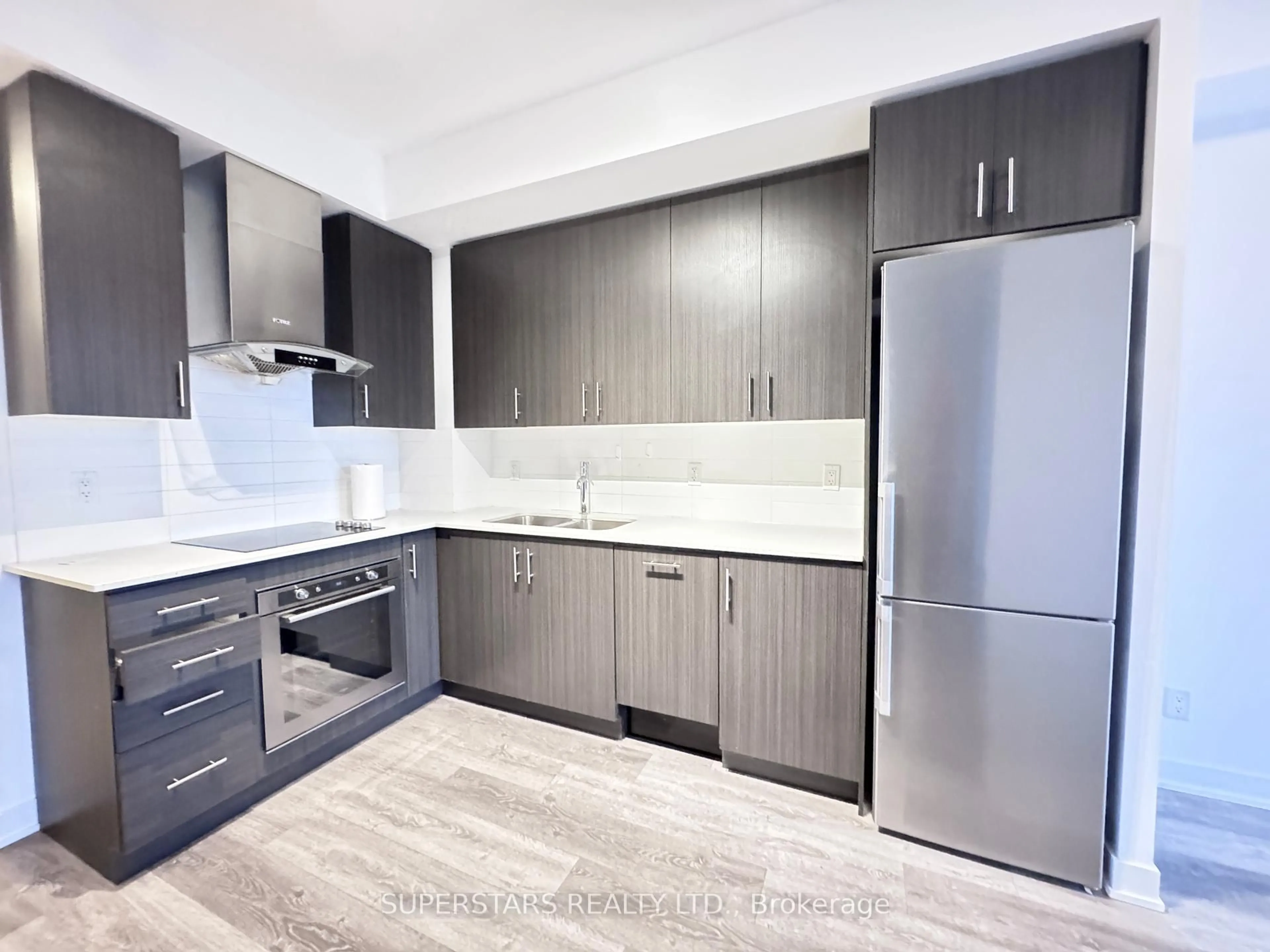 Standard kitchen, wood/laminate floor for 195 Bonis Ave #308, Toronto Ontario M1T 0A5