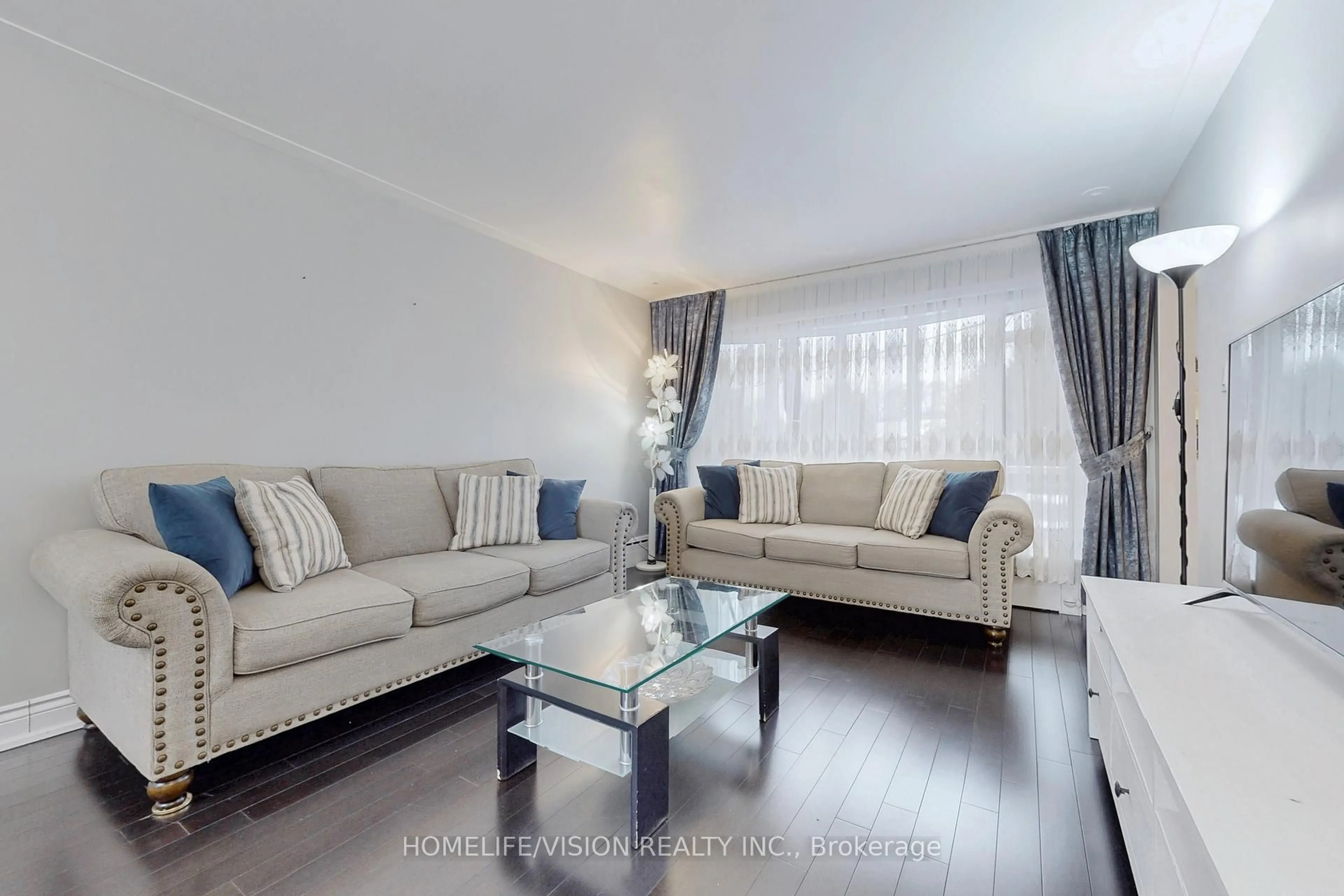 Living room with furniture, wood/laminate floor for 15 Ivordale Cres, Toronto Ontario M1R 2W5