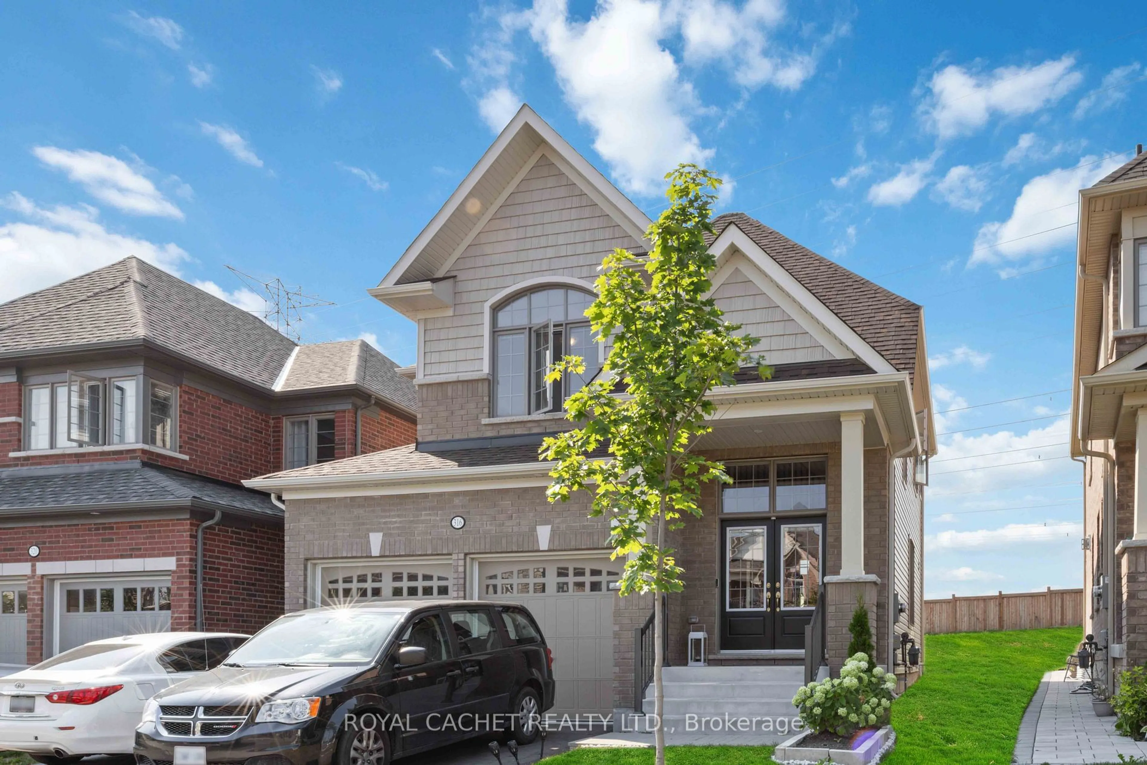 Home with brick exterior material, street for 316 Windfields Farms Dr, Oshawa Ontario L1L 0M3