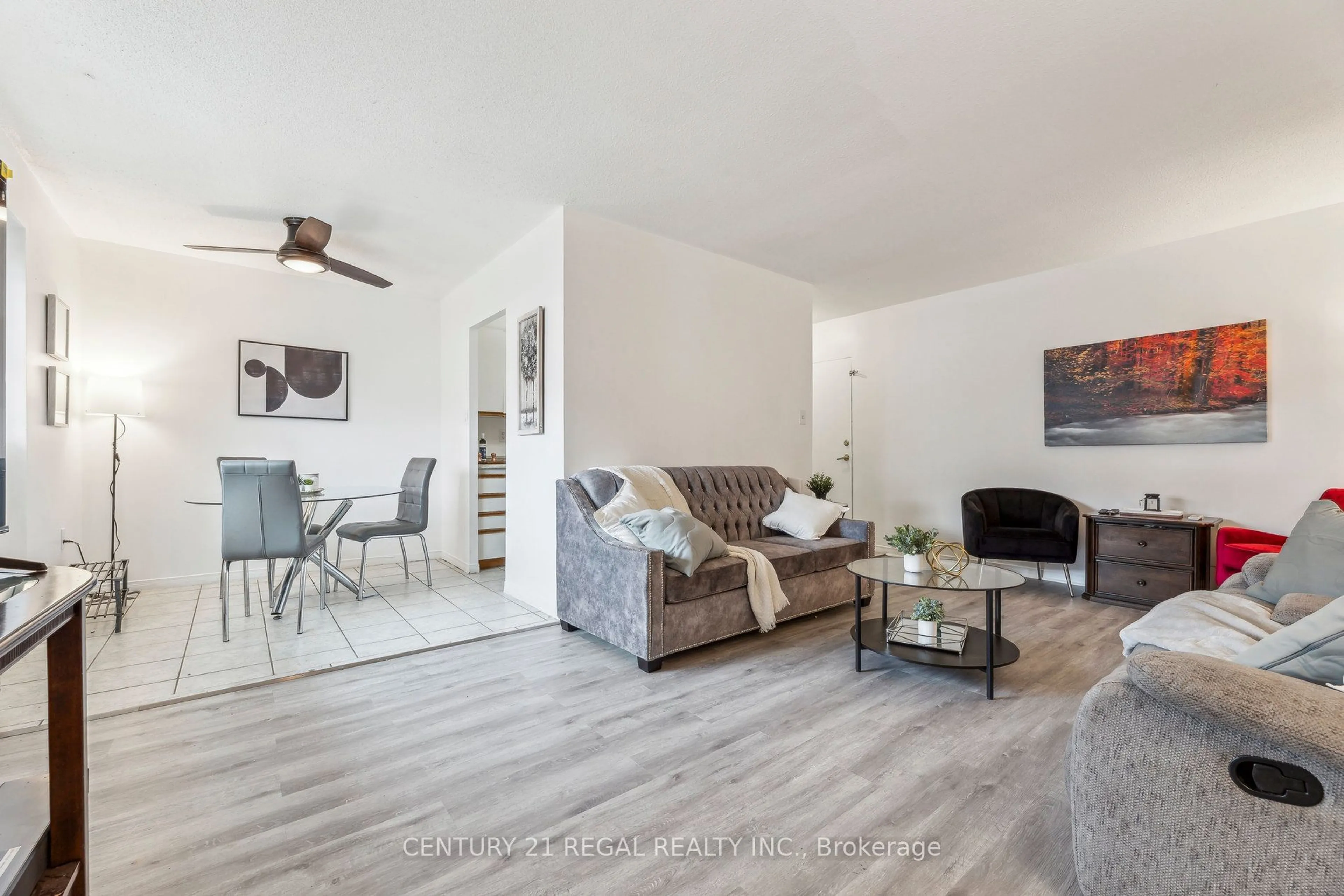 Living room with furniture, wood/laminate floor for 936 Glen St #107, Oshawa Ontario L1J 5Z7