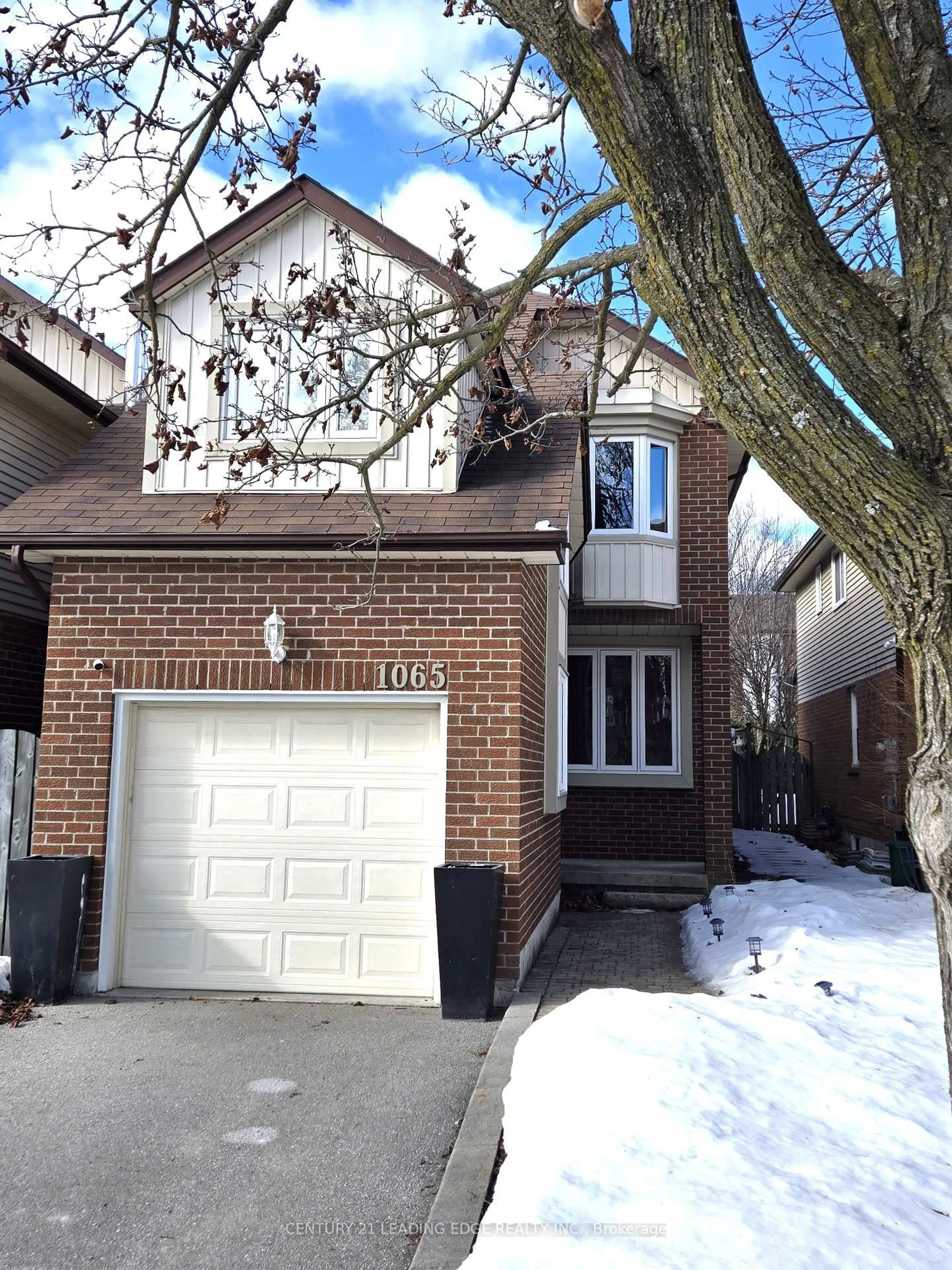 Home with brick exterior material, street for 1065 Longbow Dr, Pickering Ontario L1V 5W5