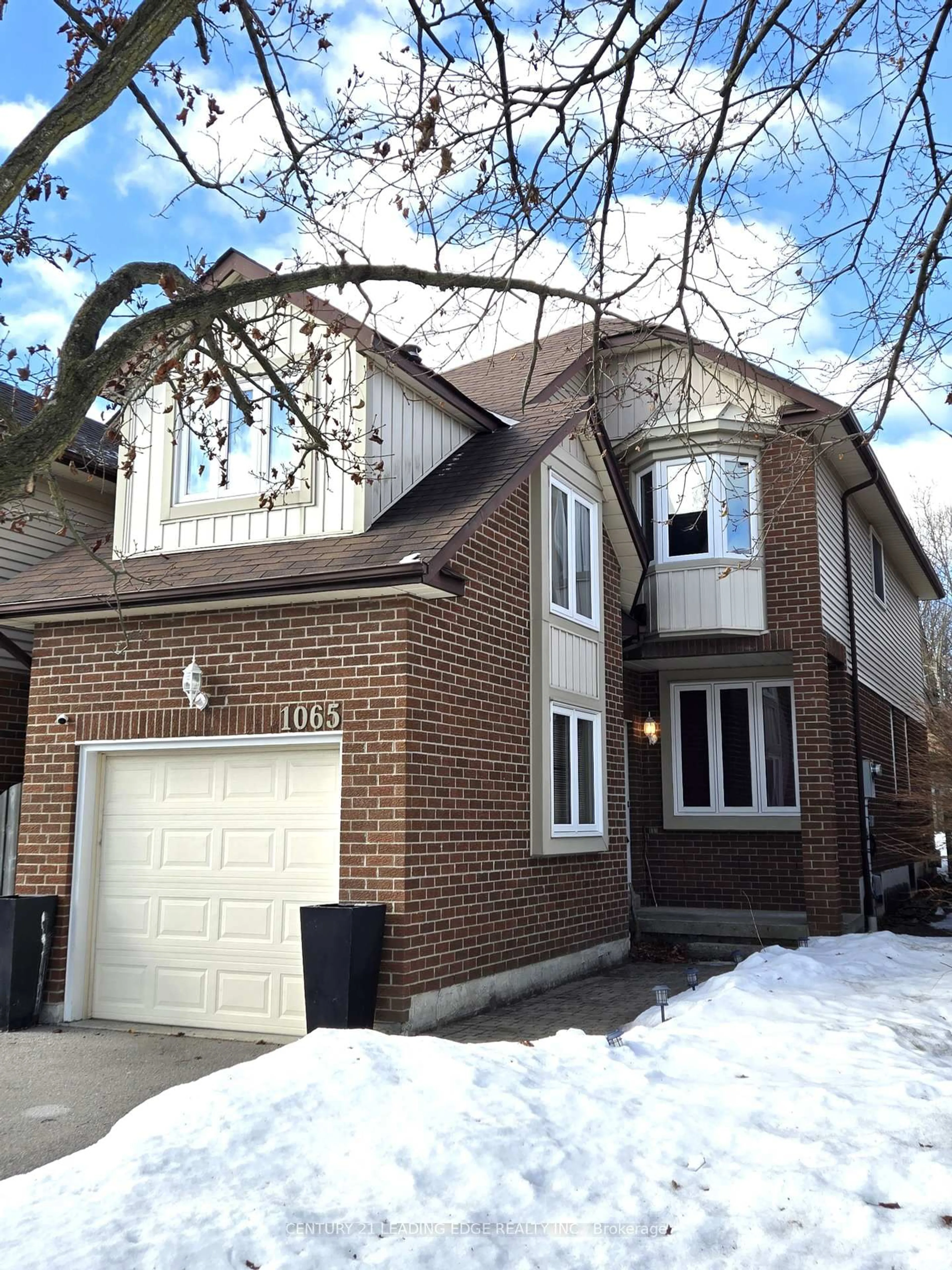 Home with brick exterior material, street for 1065 Longbow Dr, Pickering Ontario L1V 5W5