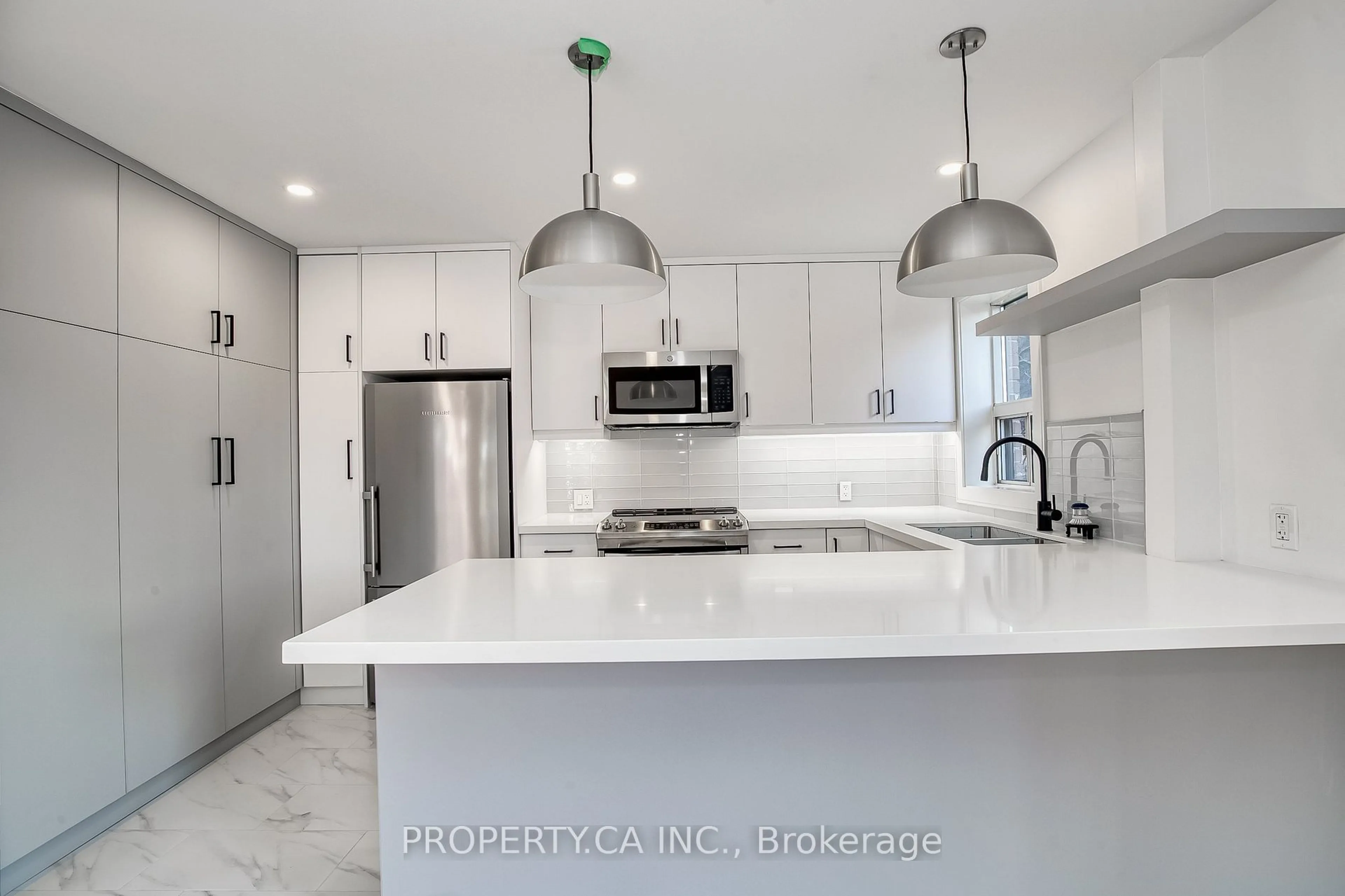 Open concept kitchen, ceramic/tile floor for 97 Lee Ave, Toronto Ontario M4E 2P2