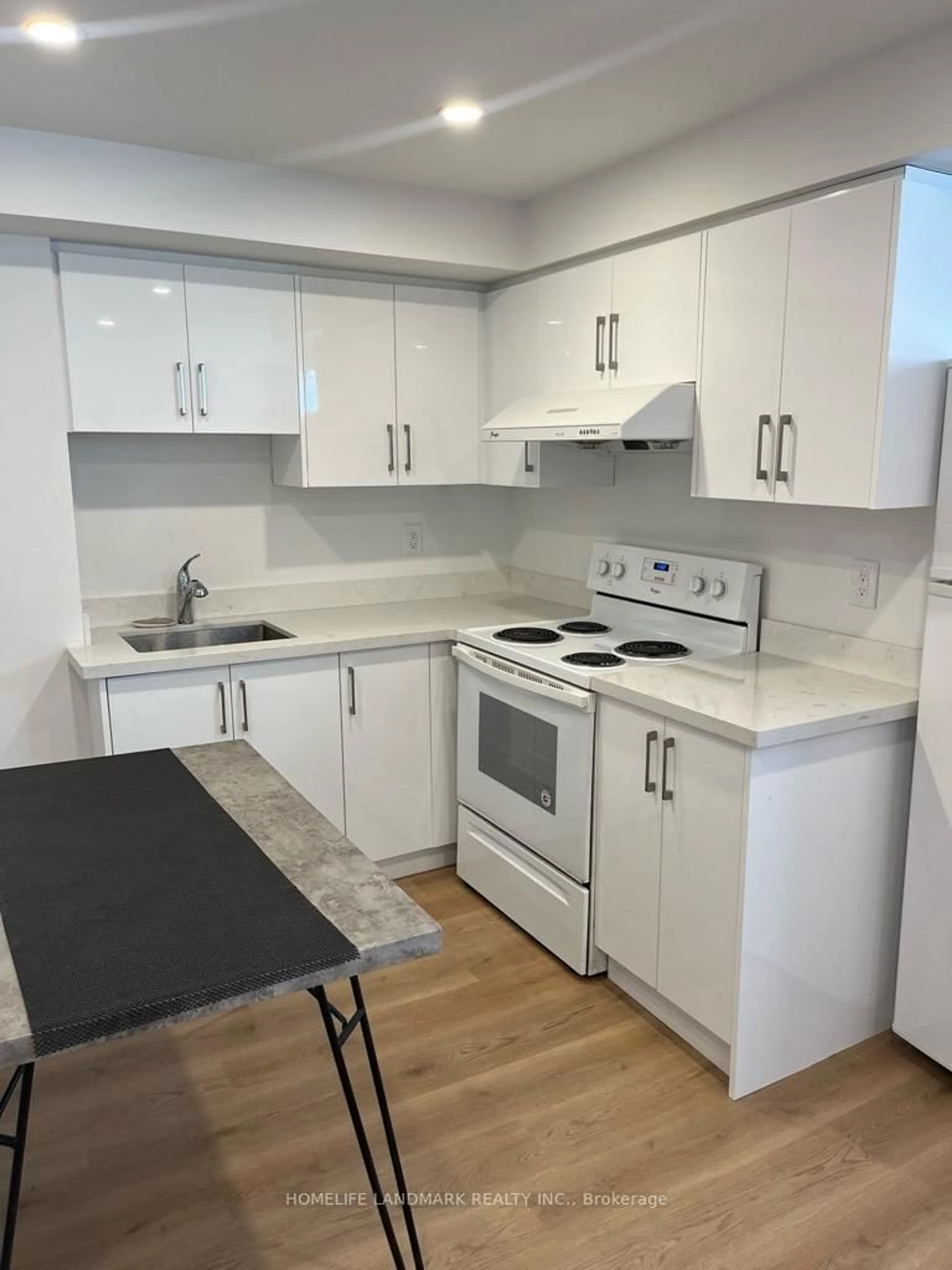 Standard kitchen, wood/laminate floor for 1251 Bridletowne Circ #8, Toronto Ontario M1W 0A5