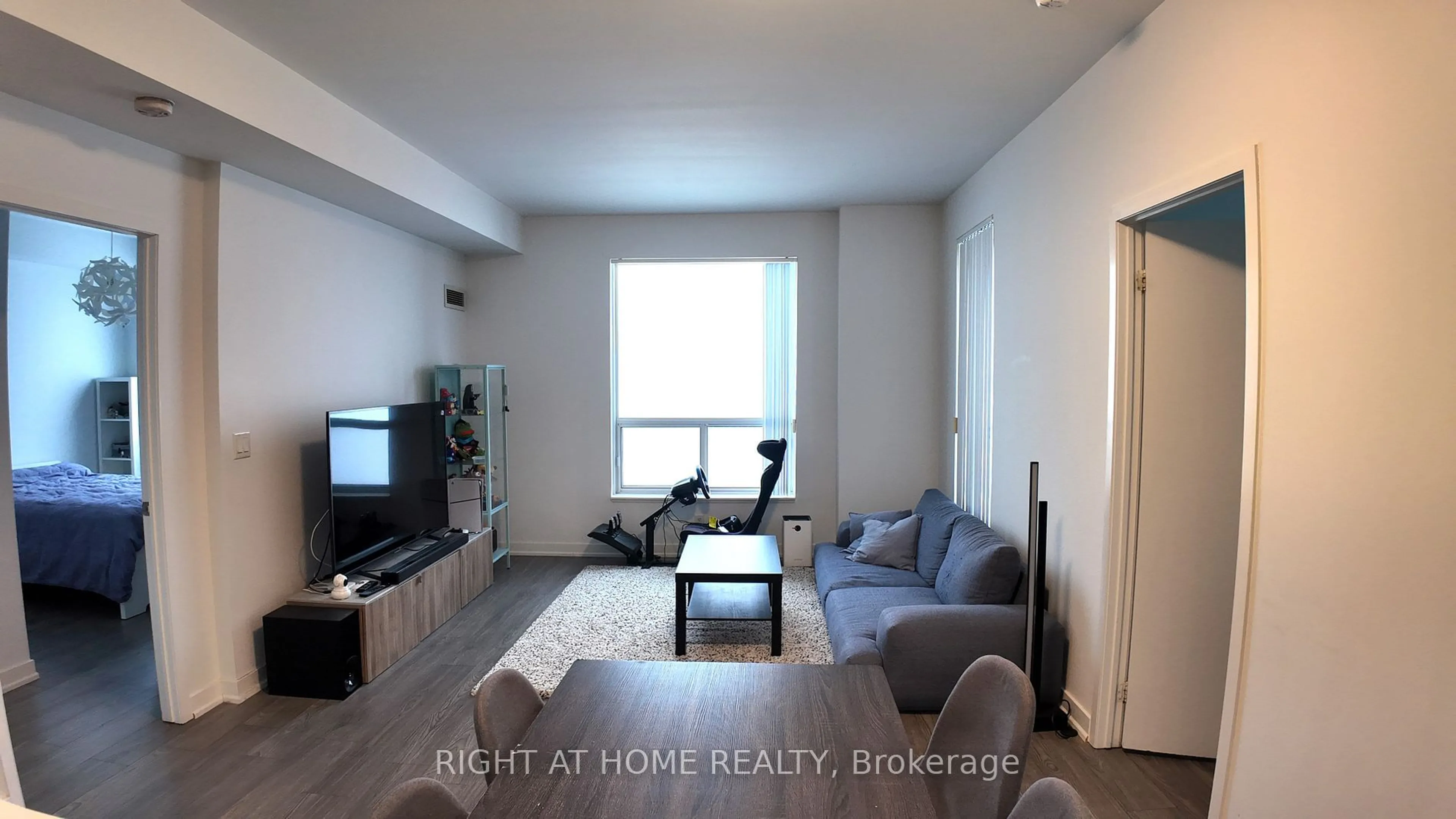 Living room with furniture, wood/laminate floor for 36 Lee Centre Dr #PH502, Toronto Ontario M1H 3K2