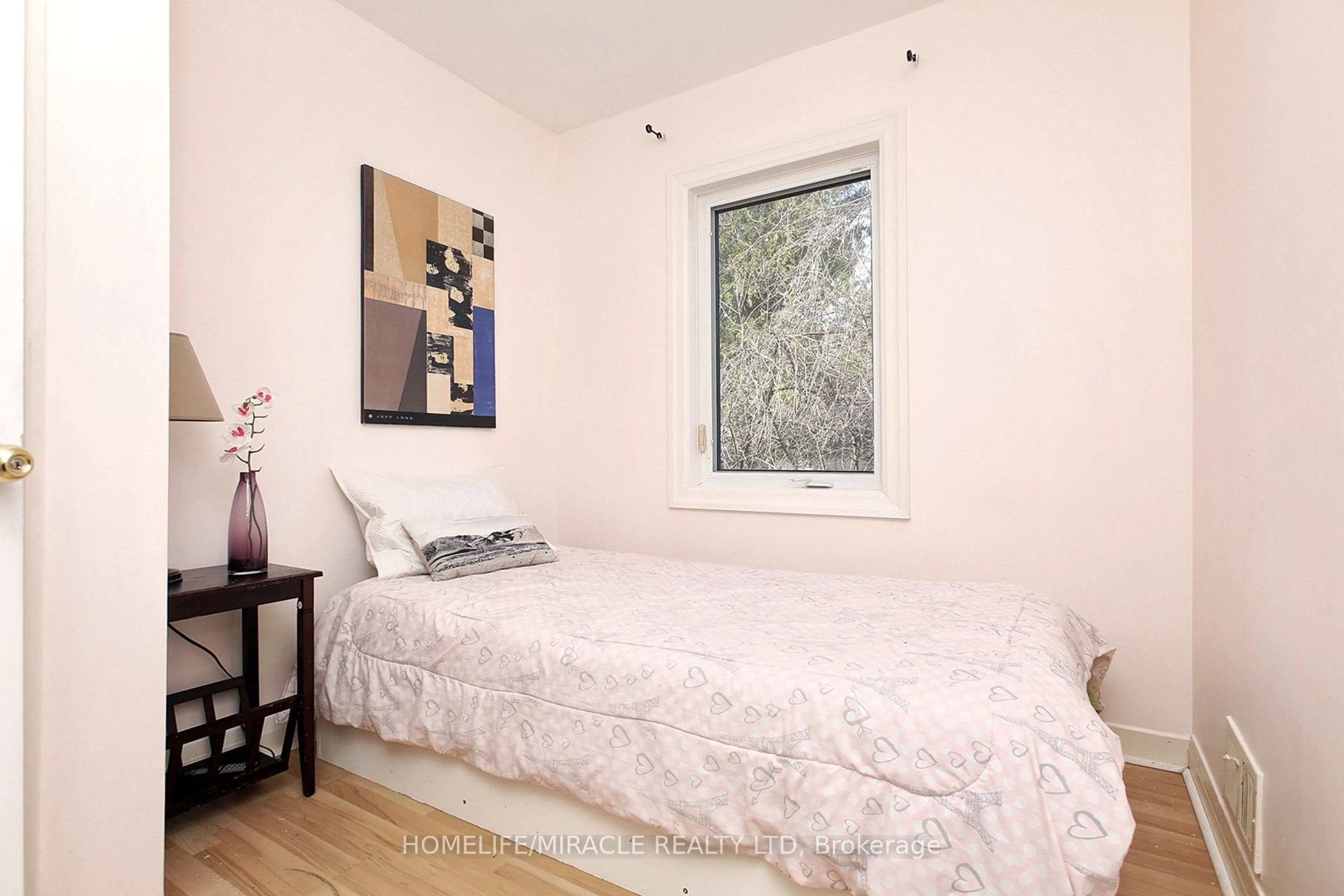 Bedroom with bed, wood/laminate floor for 23 Colonial Ave, Toronto Ontario M1M 2C3