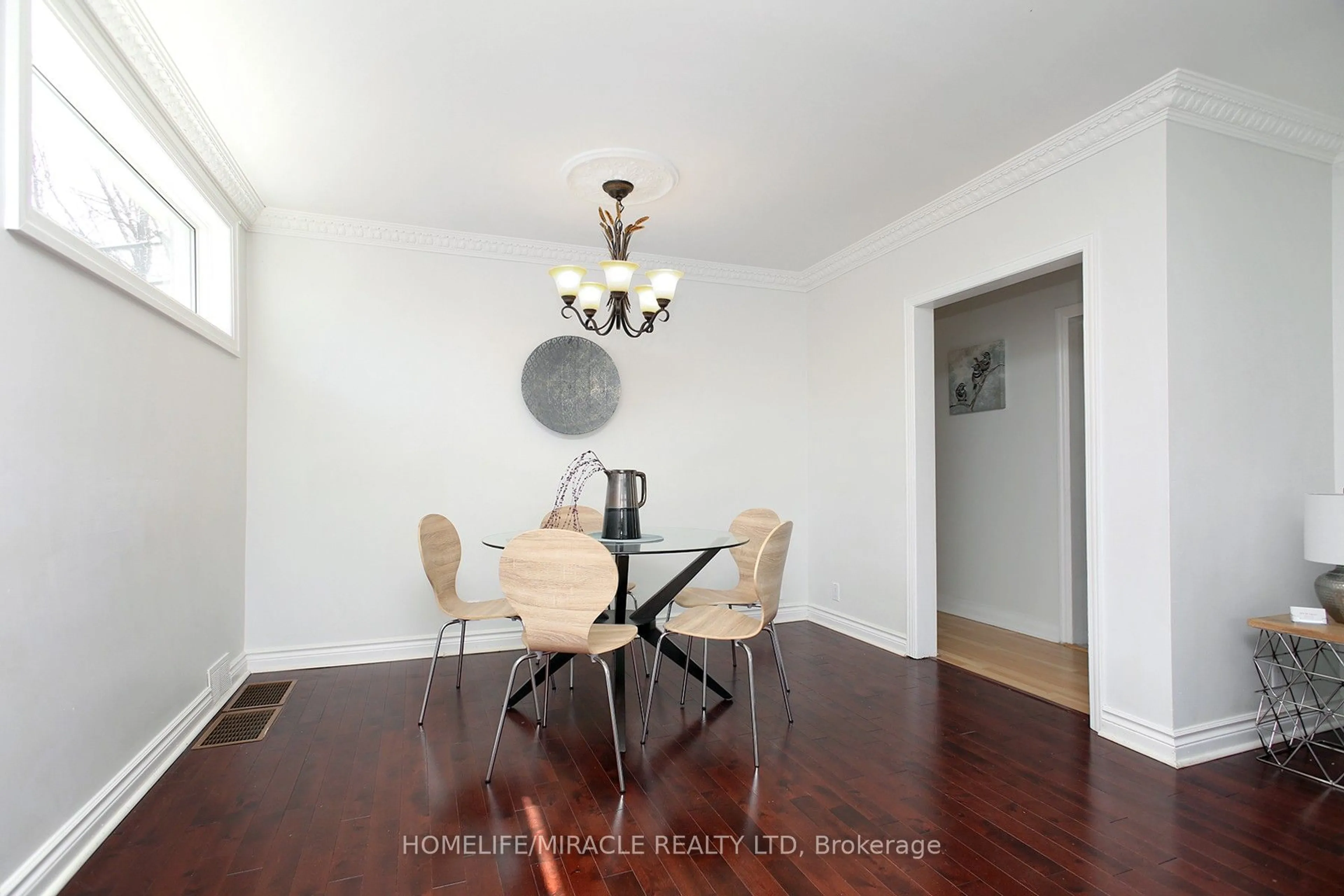 Dining room, wood/laminate floor for 23 Colonial Ave, Toronto Ontario M1M 2C3