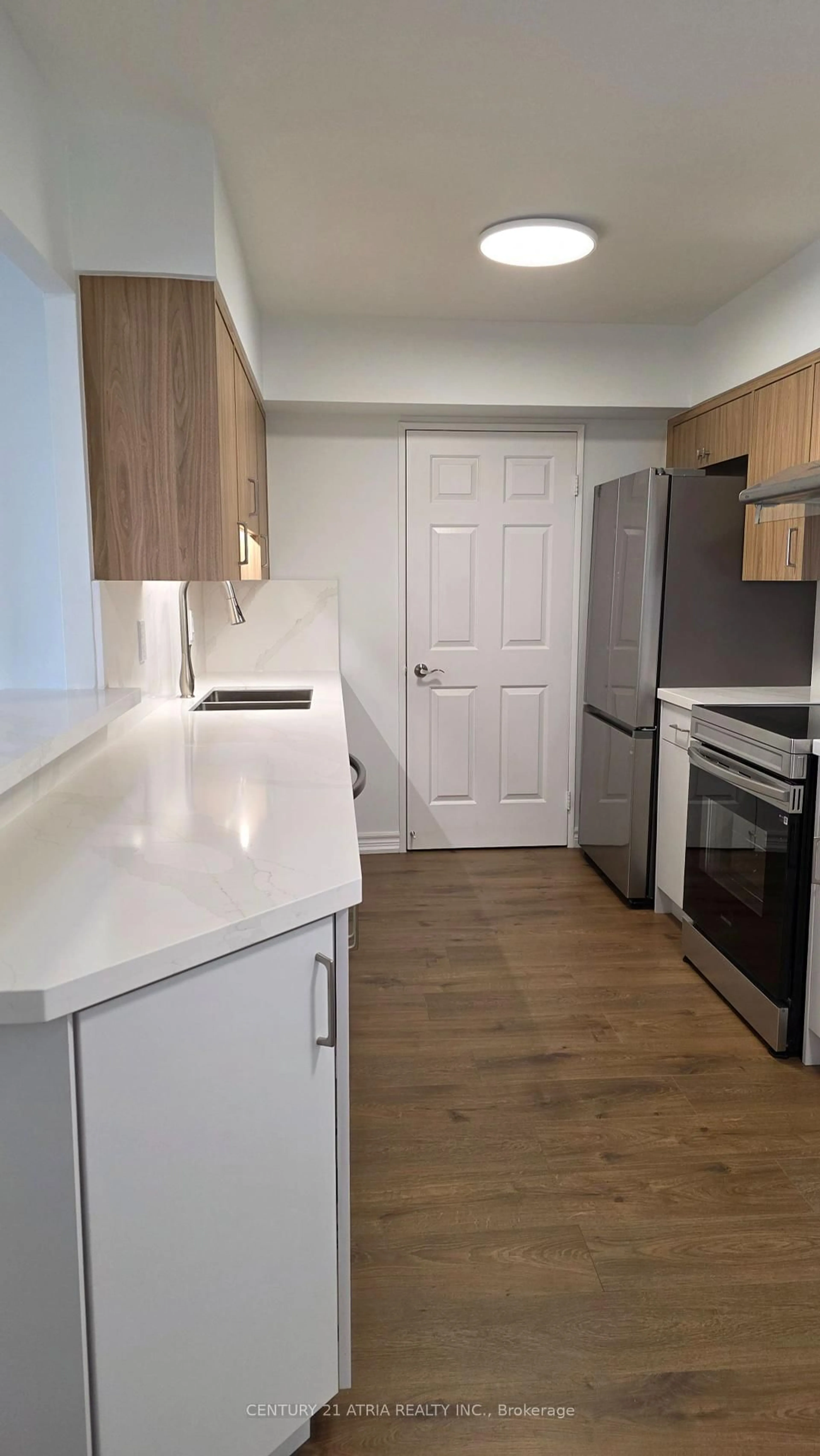 Standard kitchen, wood/laminate floor for 175 Bamburgh Circ #1902, Toronto Ontario M1W 3X8