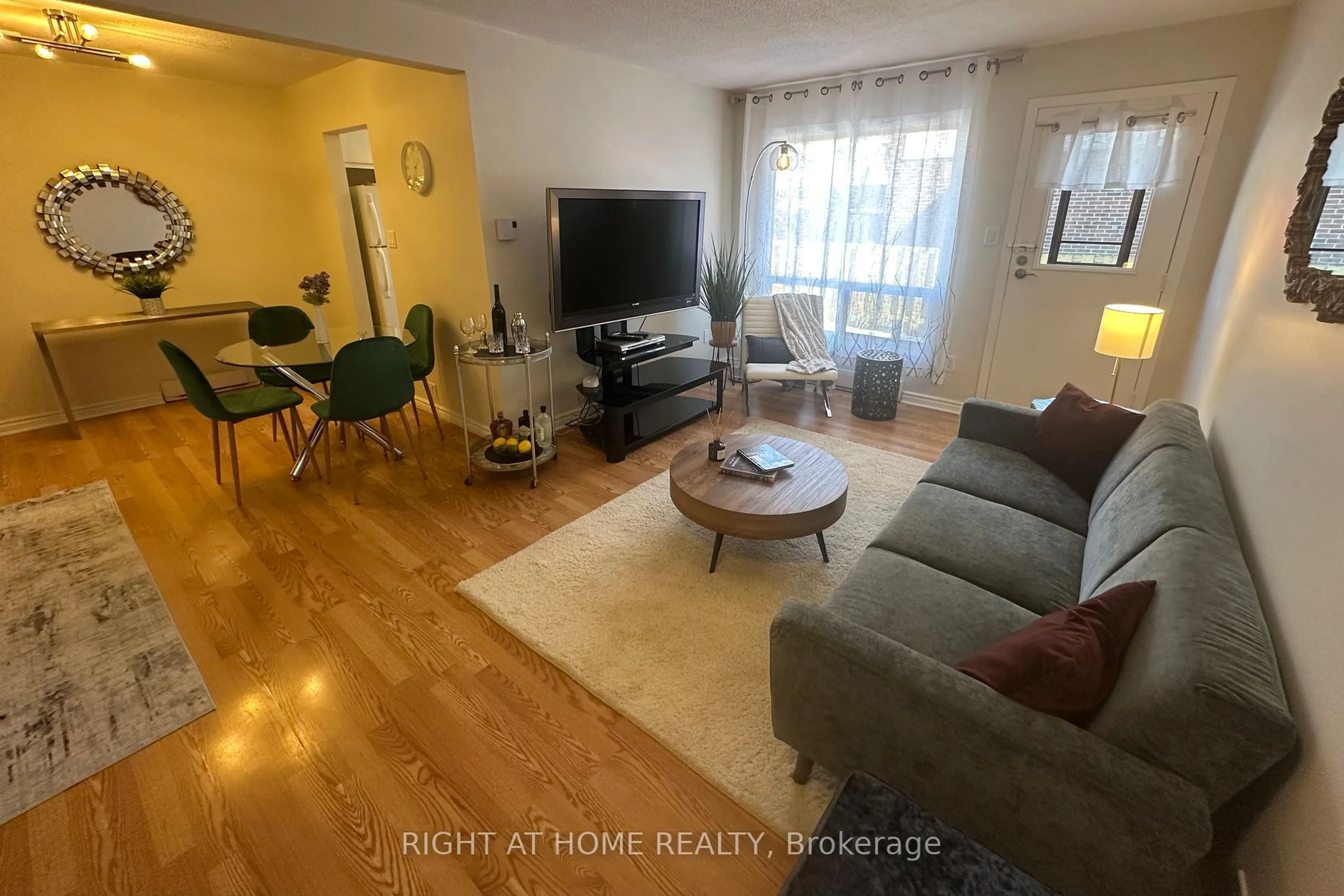 Living room with furniture, wood/laminate floor for 1100 Oxford St #44, Oshawa Ontario L1J 6G4