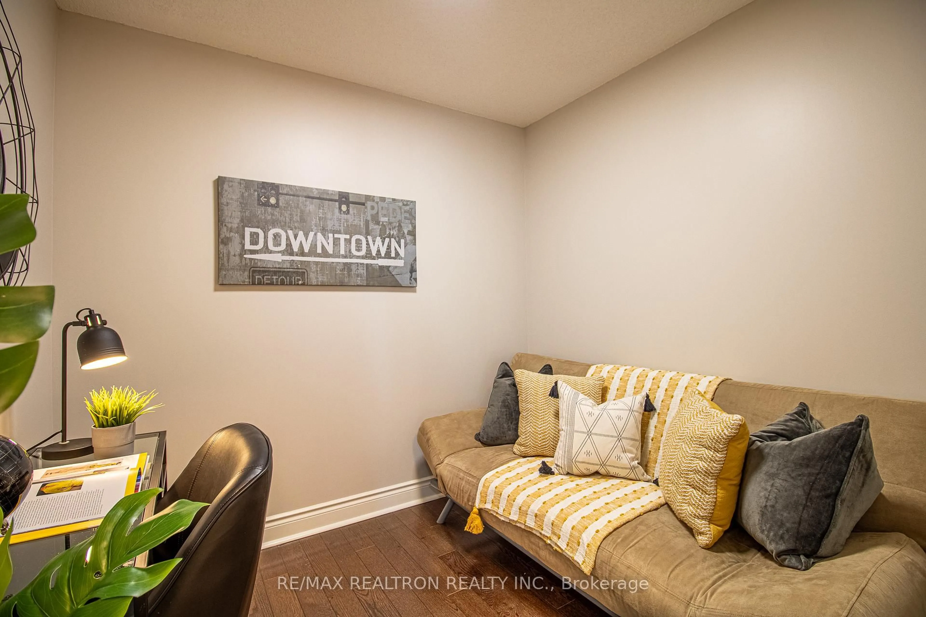 Living room with furniture, wood/laminate floor for 50 Brian Harrison Way #1201, Toronto Ontario M1P 5J4