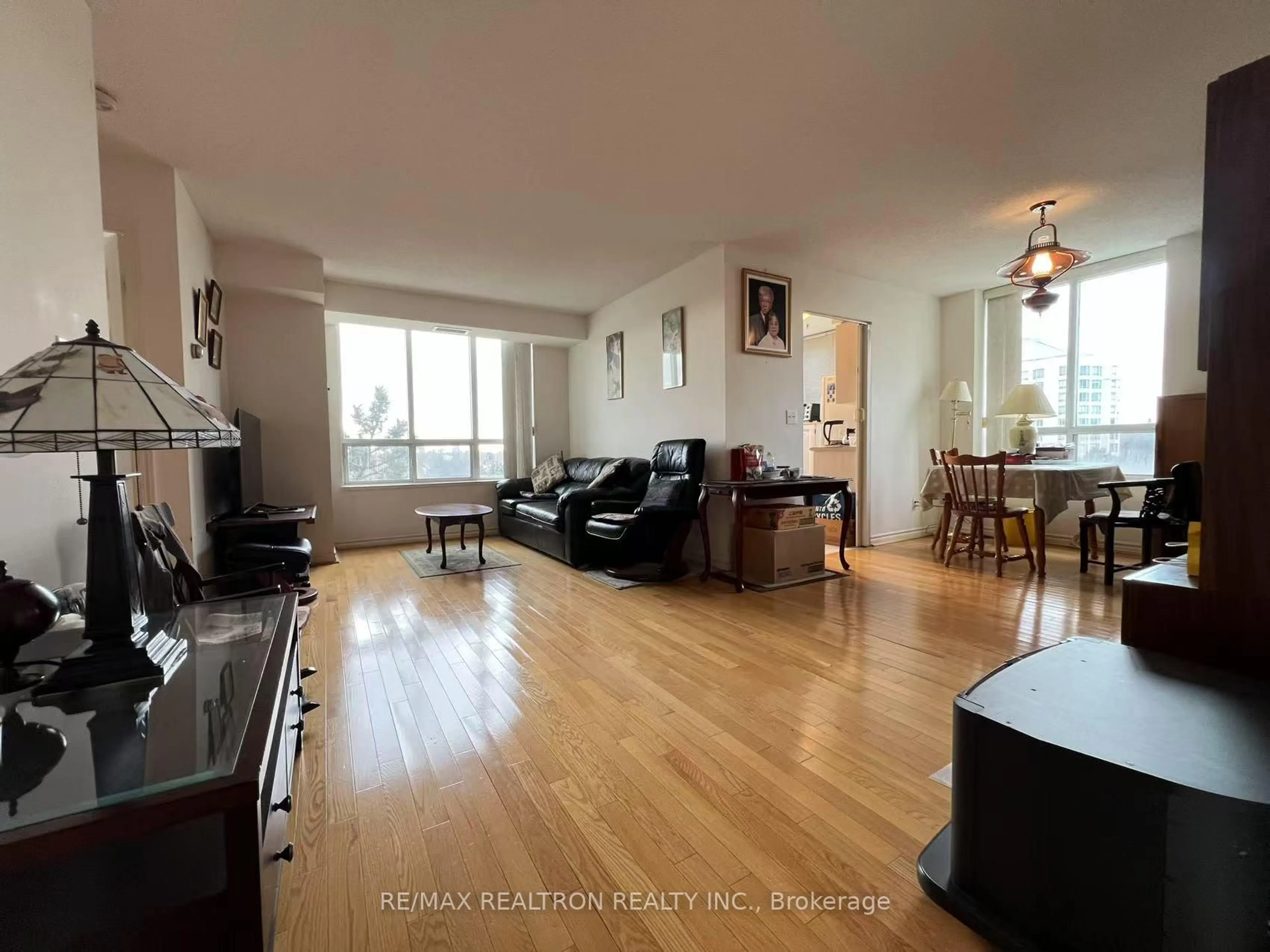 Living room with furniture, wood/laminate floor for 5039 Finch Ave #510, Toronto Ontario M1S 5L6