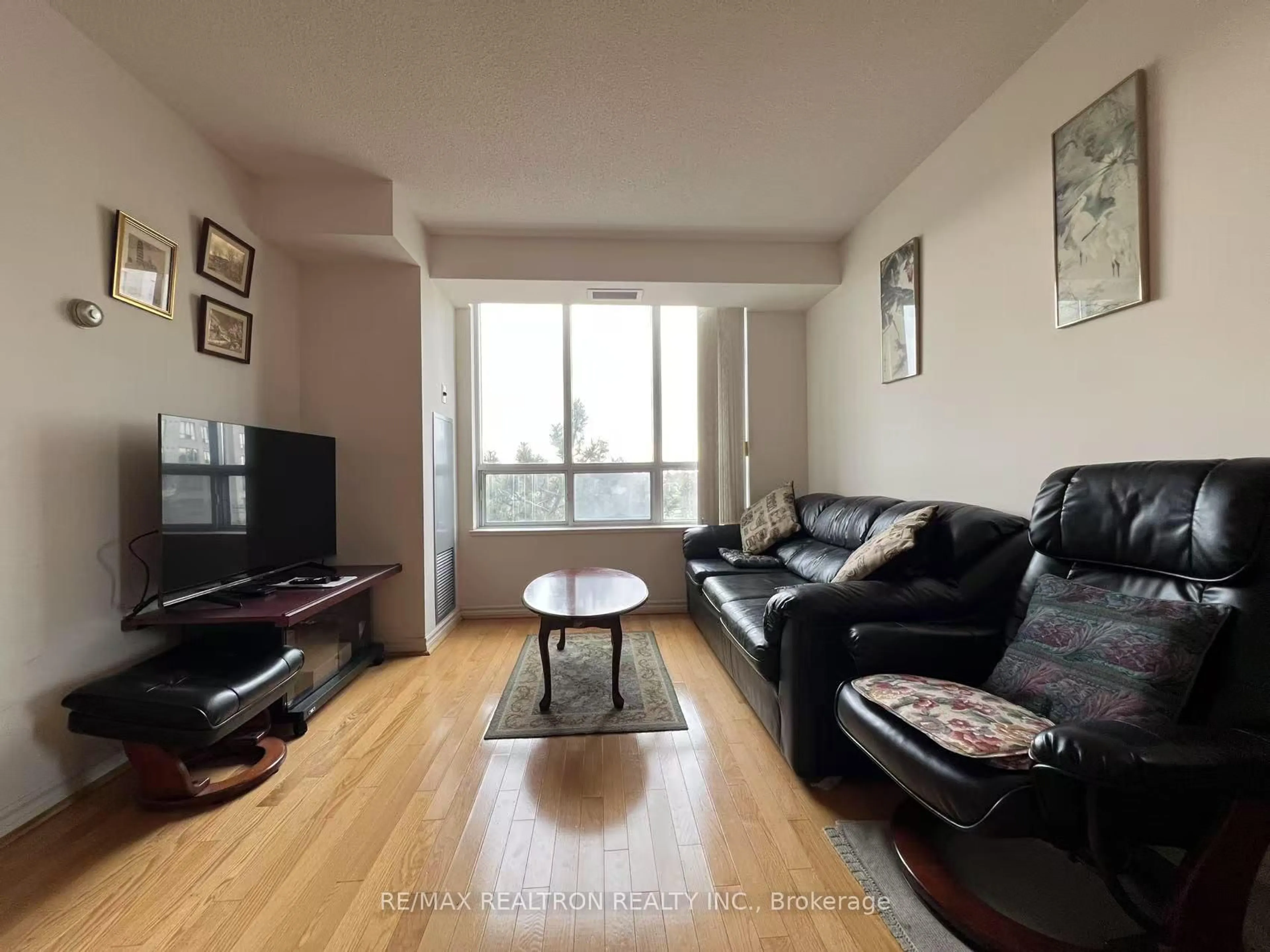 Living room with furniture, wood/laminate floor for 5039 Finch Ave #510, Toronto Ontario M1S 5L6