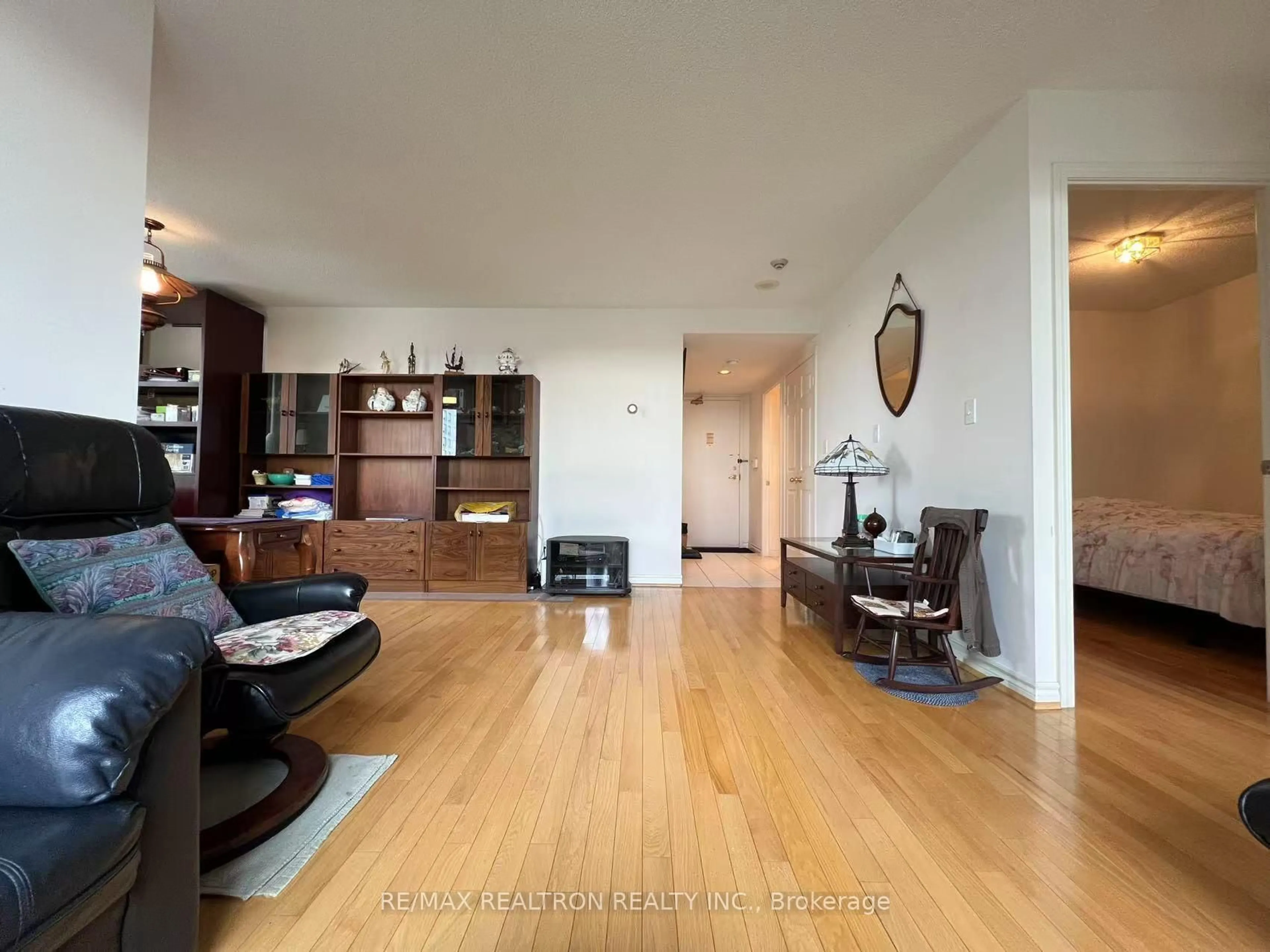 Living room with furniture, wood/laminate floor for 5039 Finch Ave #510, Toronto Ontario M1S 5L6