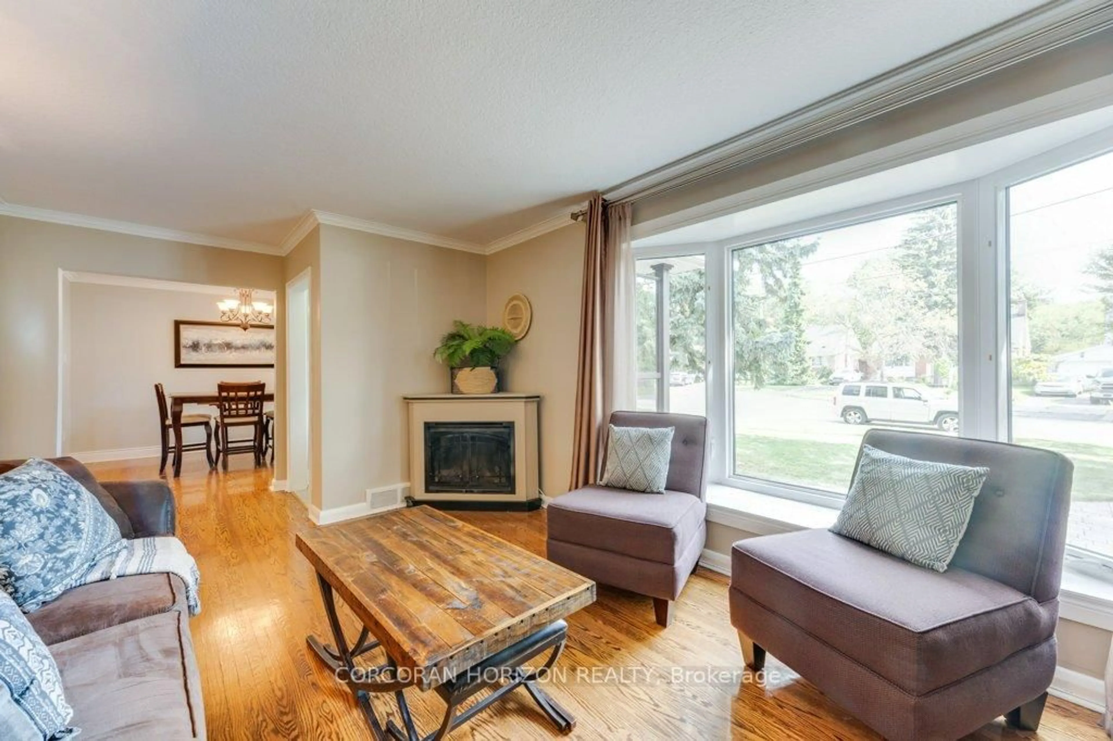 Living room with furniture, wood/laminate floor for 26 Hopecrest Cres, Toronto Ontario M1K 2K4