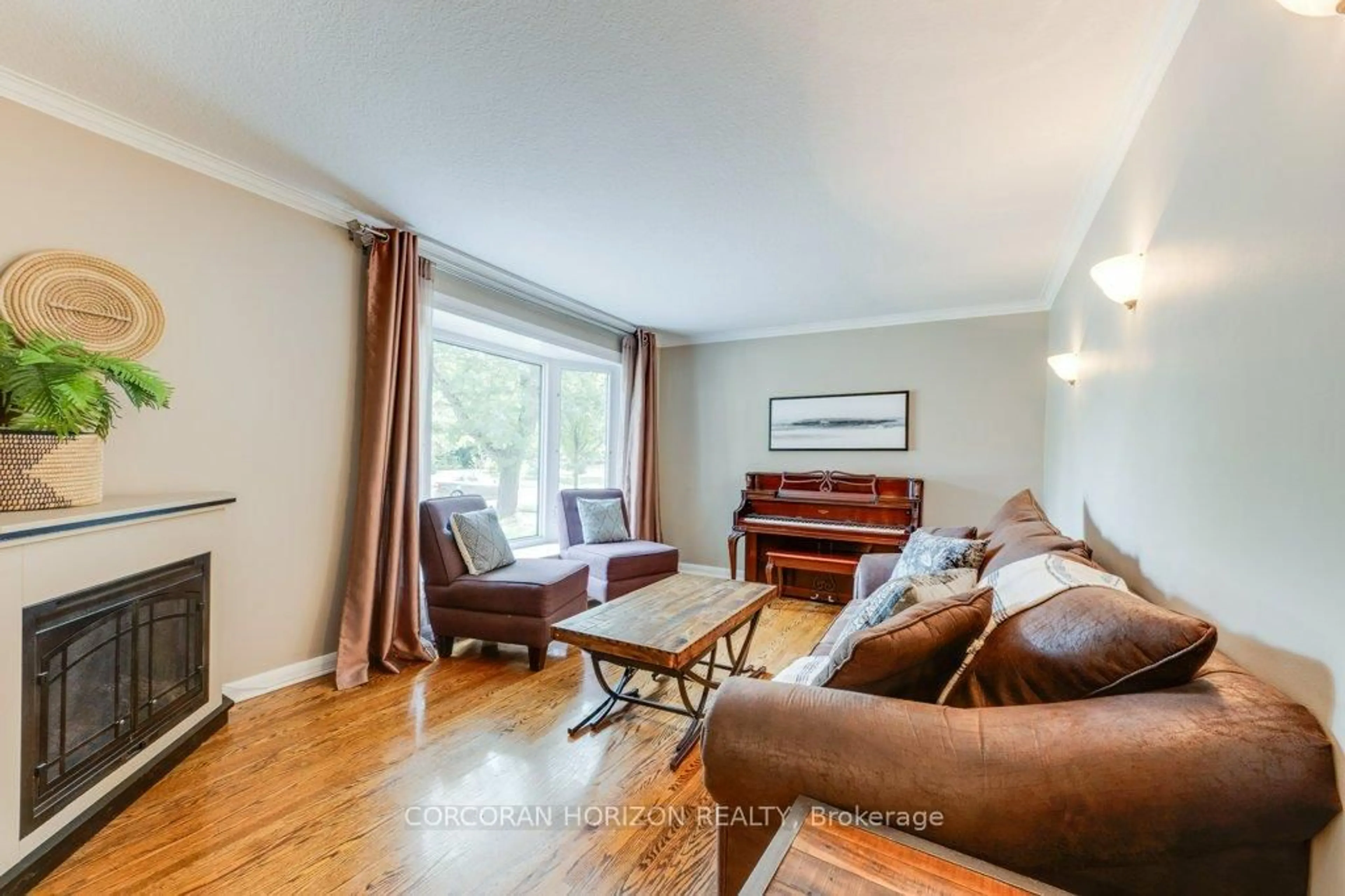 Living room with furniture, wood/laminate floor for 26 Hopecrest Cres, Toronto Ontario M1K 2K4
