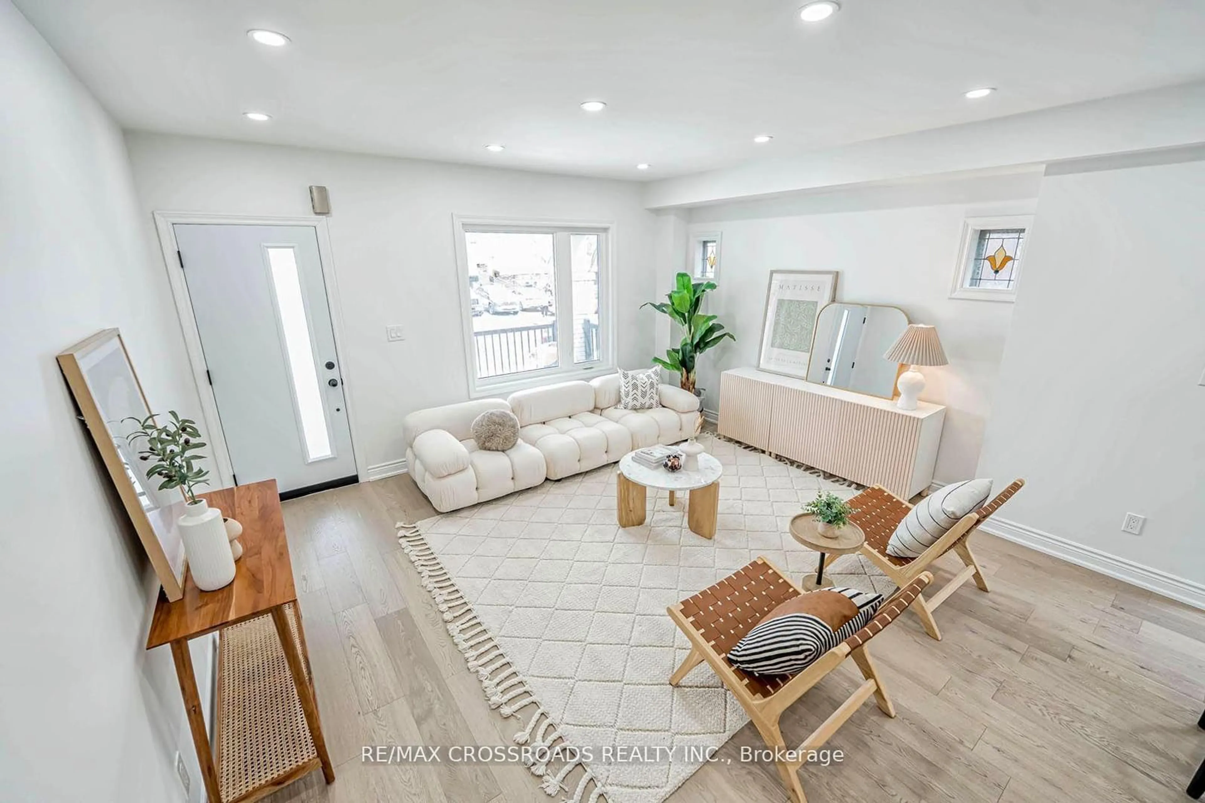 Living room with furniture, wood/laminate floor for 548 Glebeholme Blvd, Toronto Ontario M4C 1V4