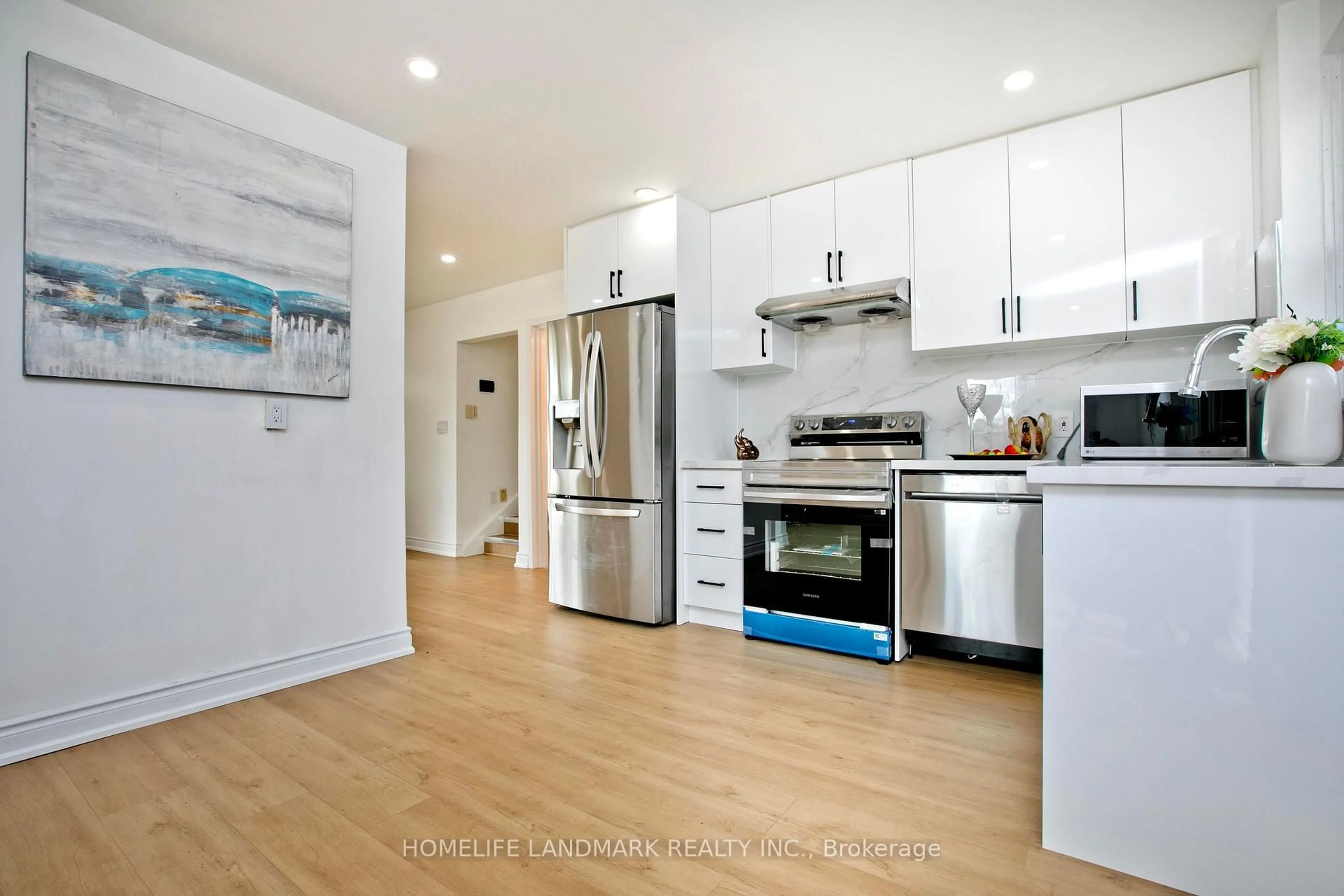 Open concept kitchen, wood/laminate floor for 56 Blaisdale Rd, Toronto Ontario M1P 1V8