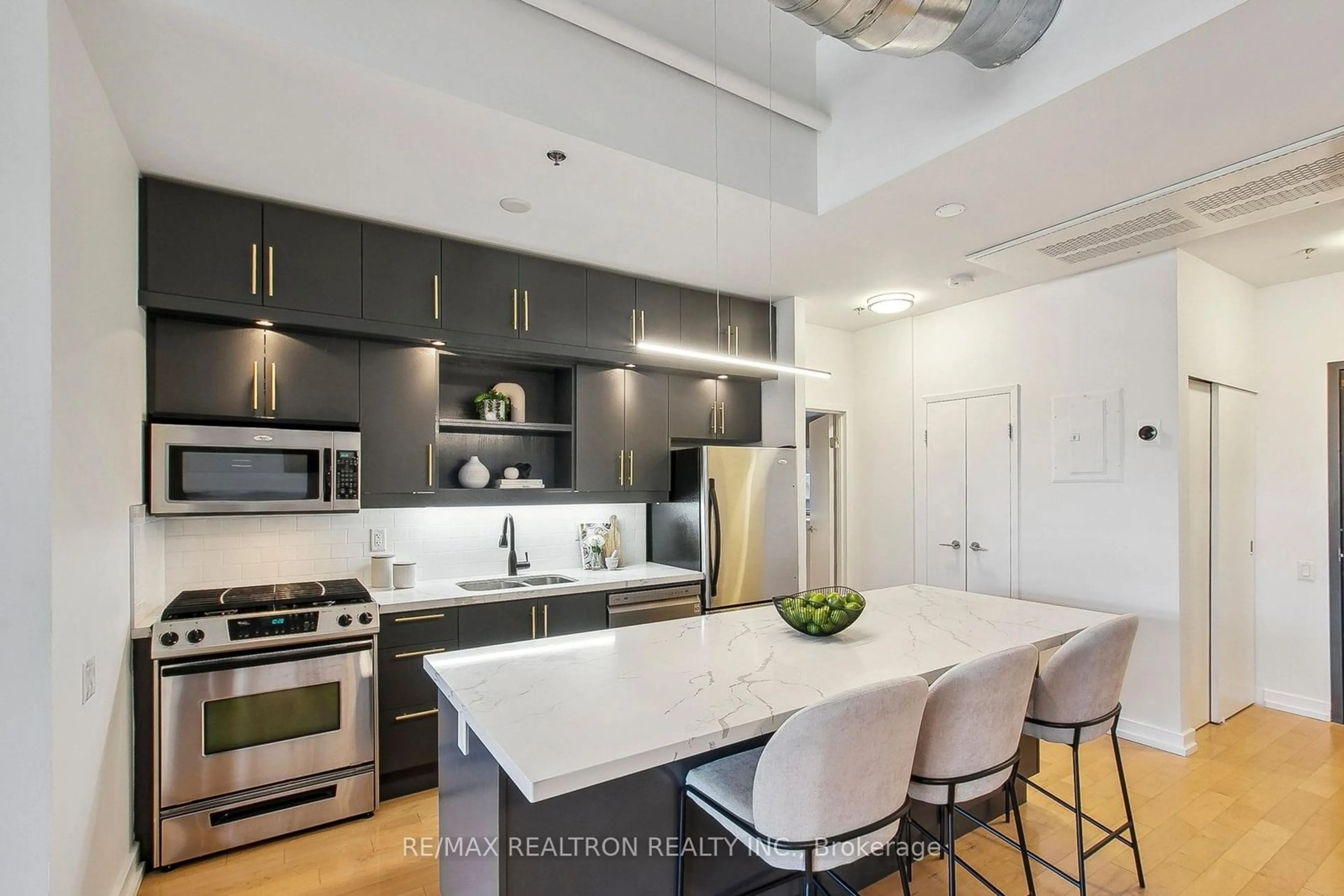 Open concept kitchen, ceramic/tile floor for 233 Carlaw Ave #205, Toronto Ontario M4M 3N6