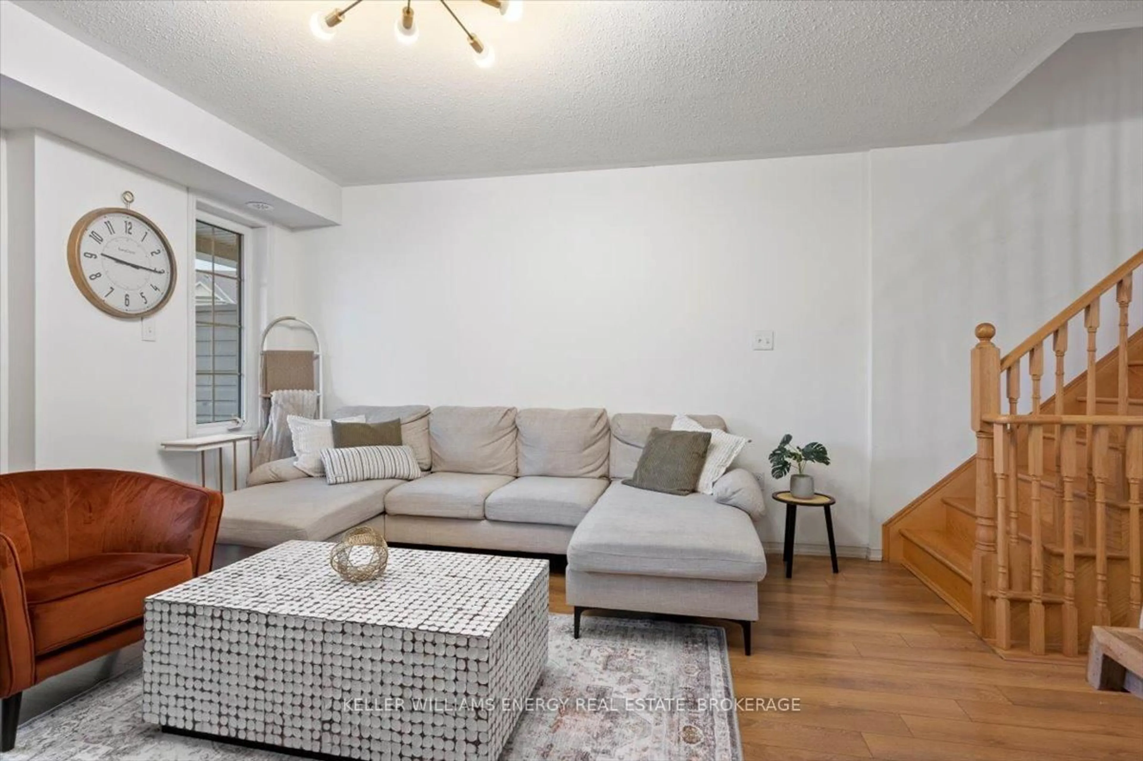 Living room with furniture, wood/laminate floor for 2372 Chevron Prince Path, Oshawa Ontario L1L 0K9
