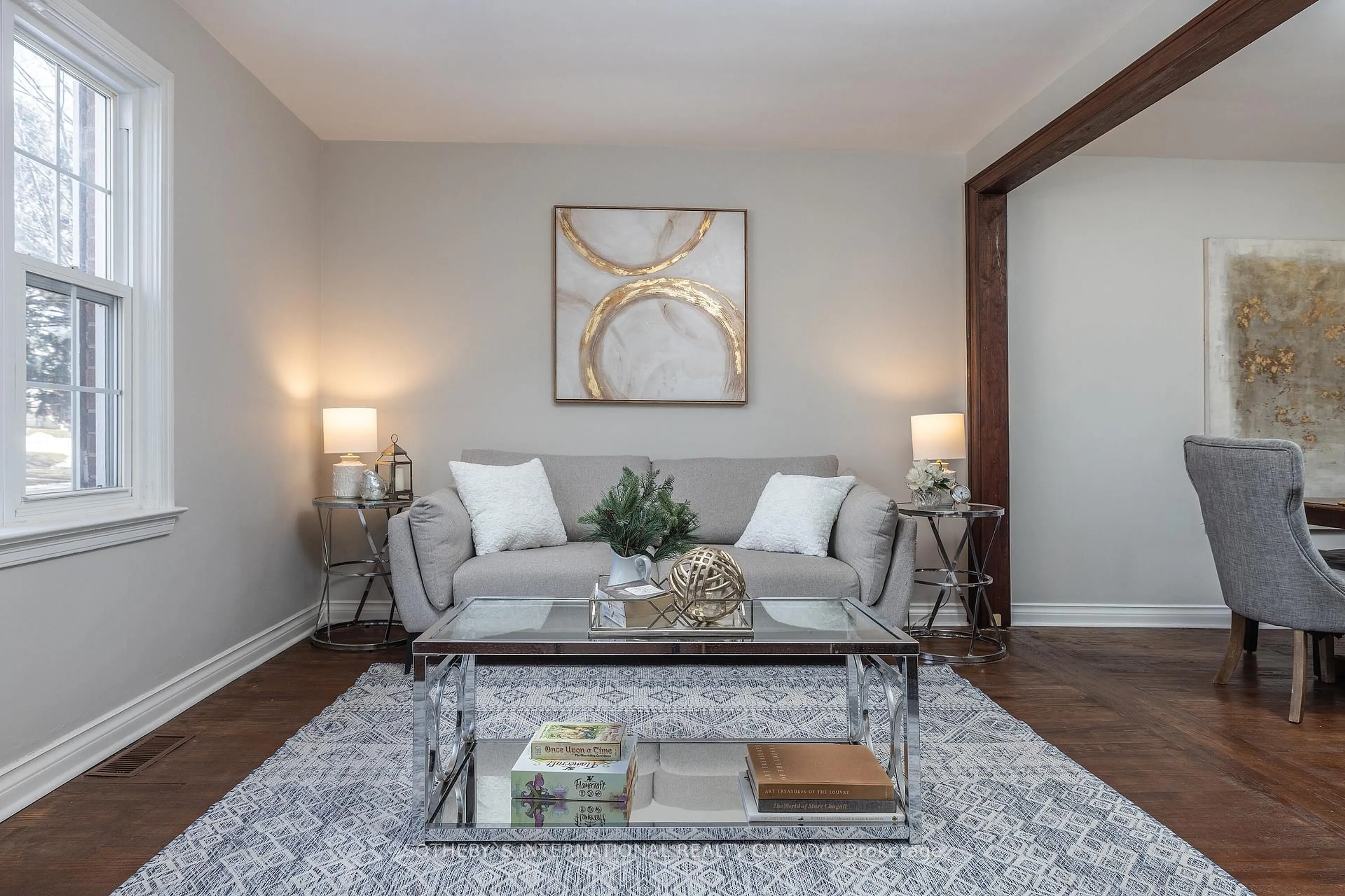 Living room with furniture, wood/laminate floor for 33 Southmead Rd, Toronto Ontario M1L 2H9