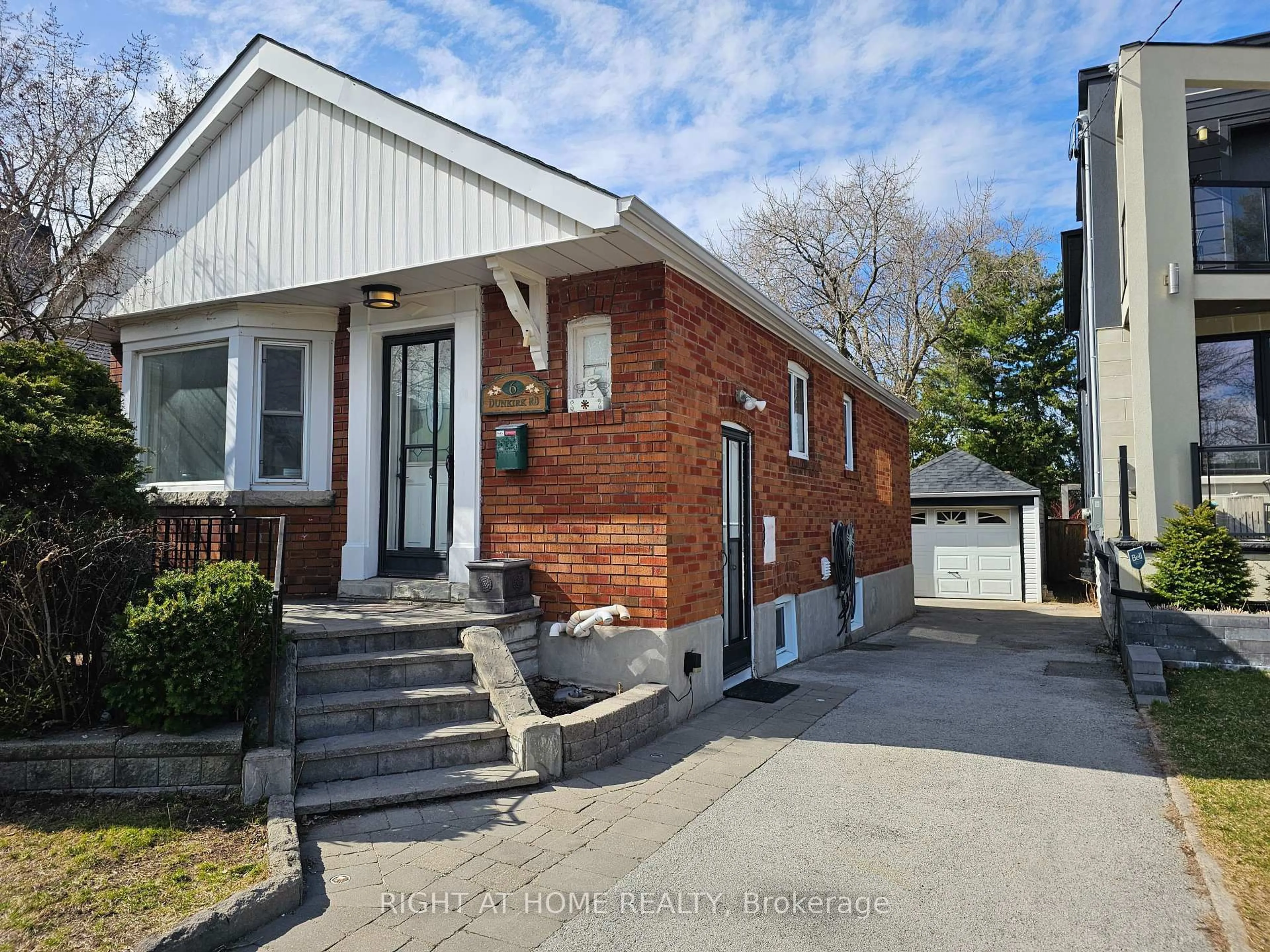 Home with brick exterior material, street for 6 Dunkirk Rd, Toronto Ontario M4C 2L9